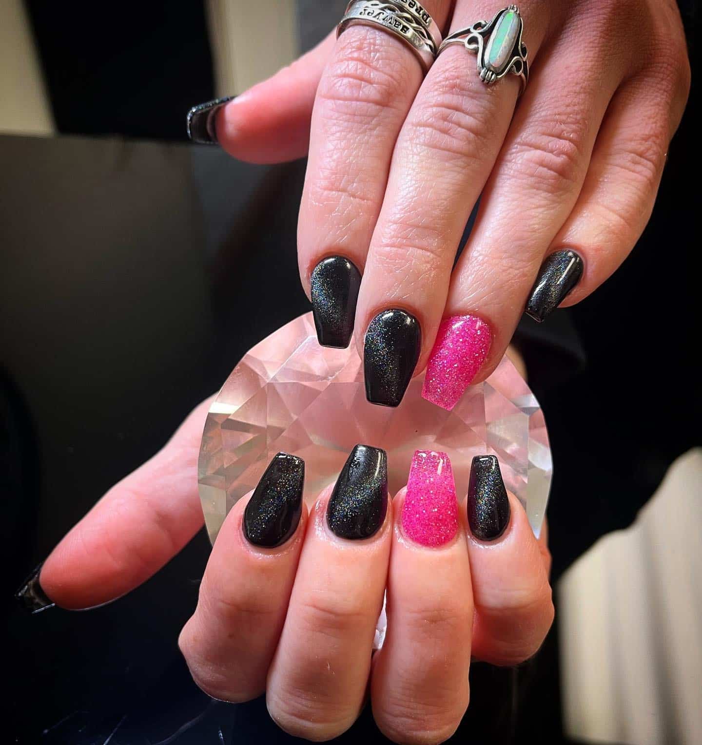 6. Glitter Pink and Cosmic Black - hot pink and black nail ideas