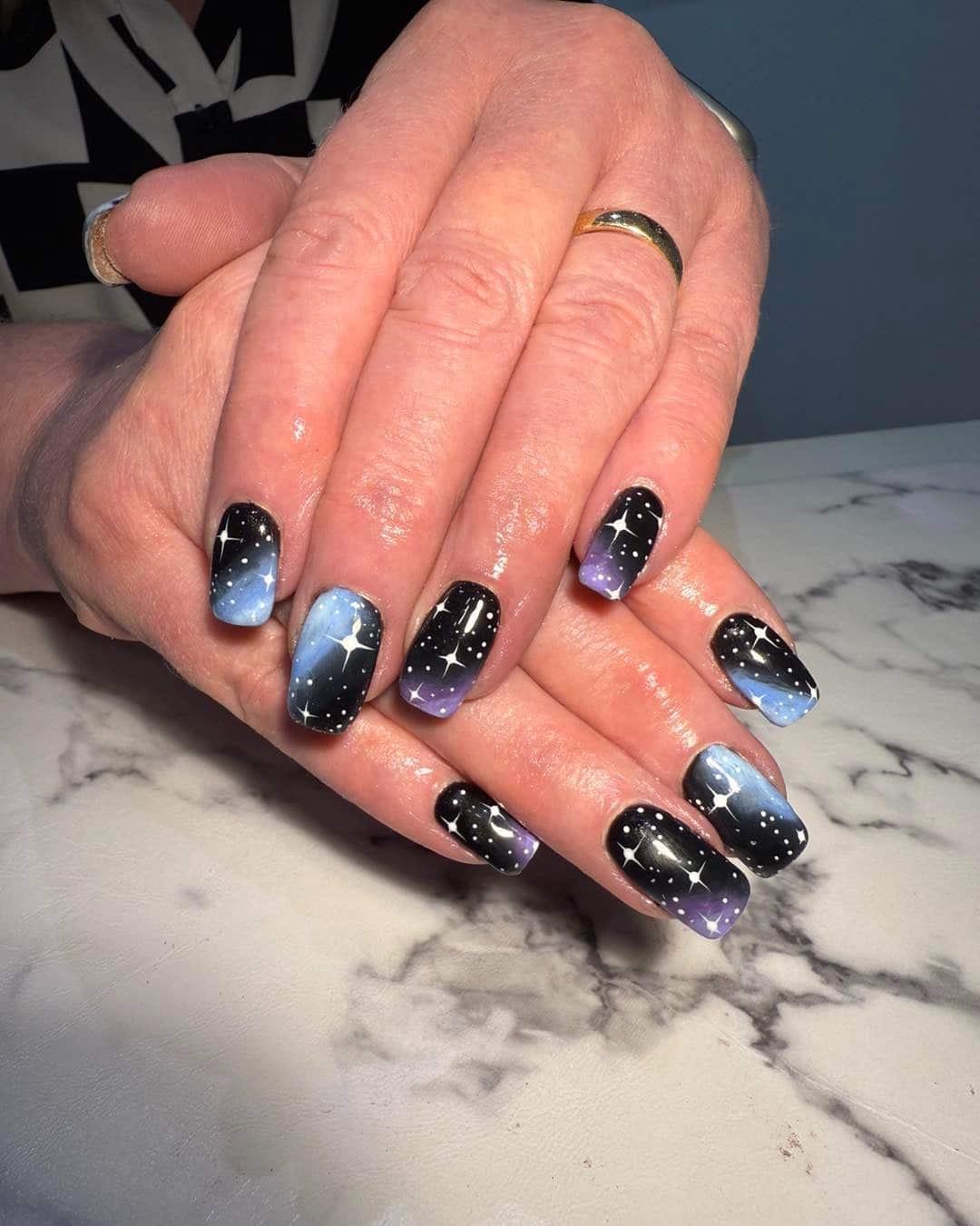 3. Cosmic Nightfall - insane nail ideas