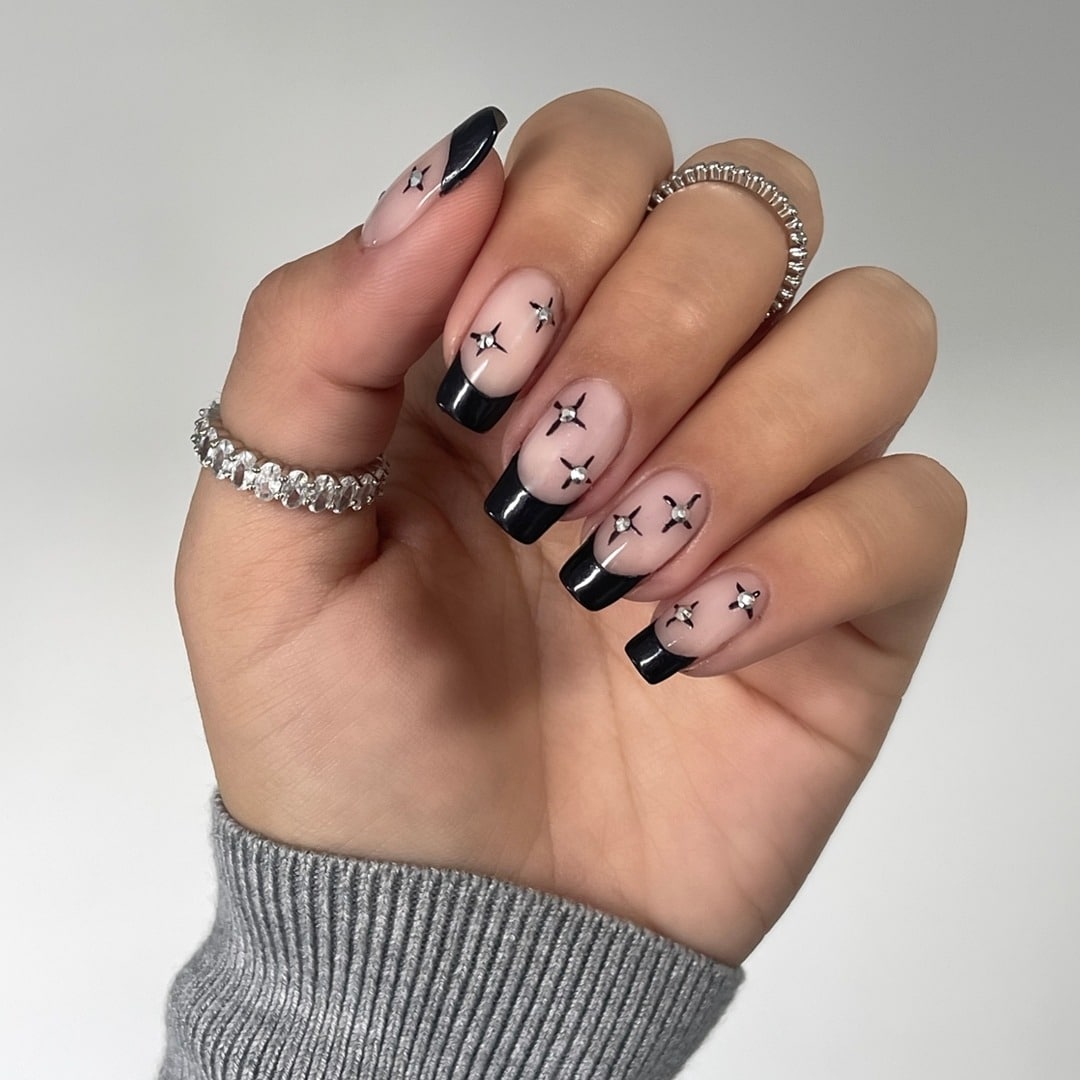 10. Noir Star Tips - insane nail ideas