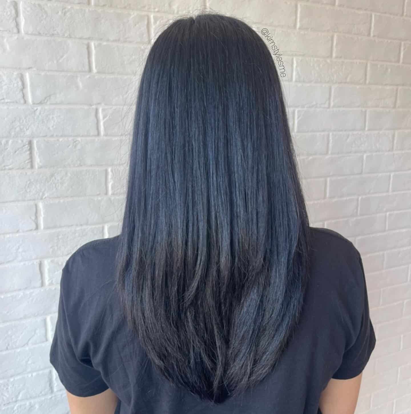 14. Sleek Layers with Dimensional Shine - Blue Black Hair Color