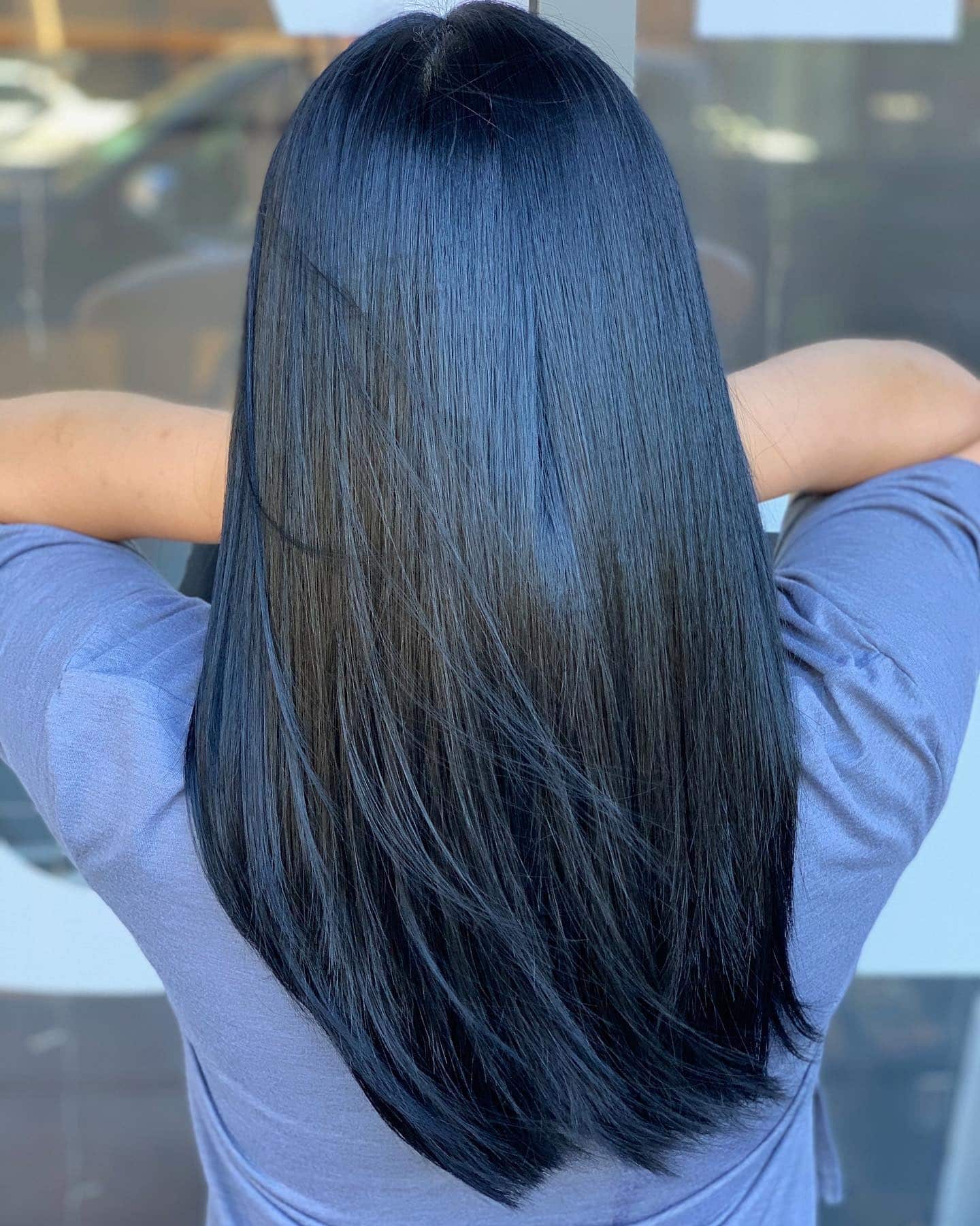 22. Sleek Layered Blue-Black Cut - Blue Black Hair Color