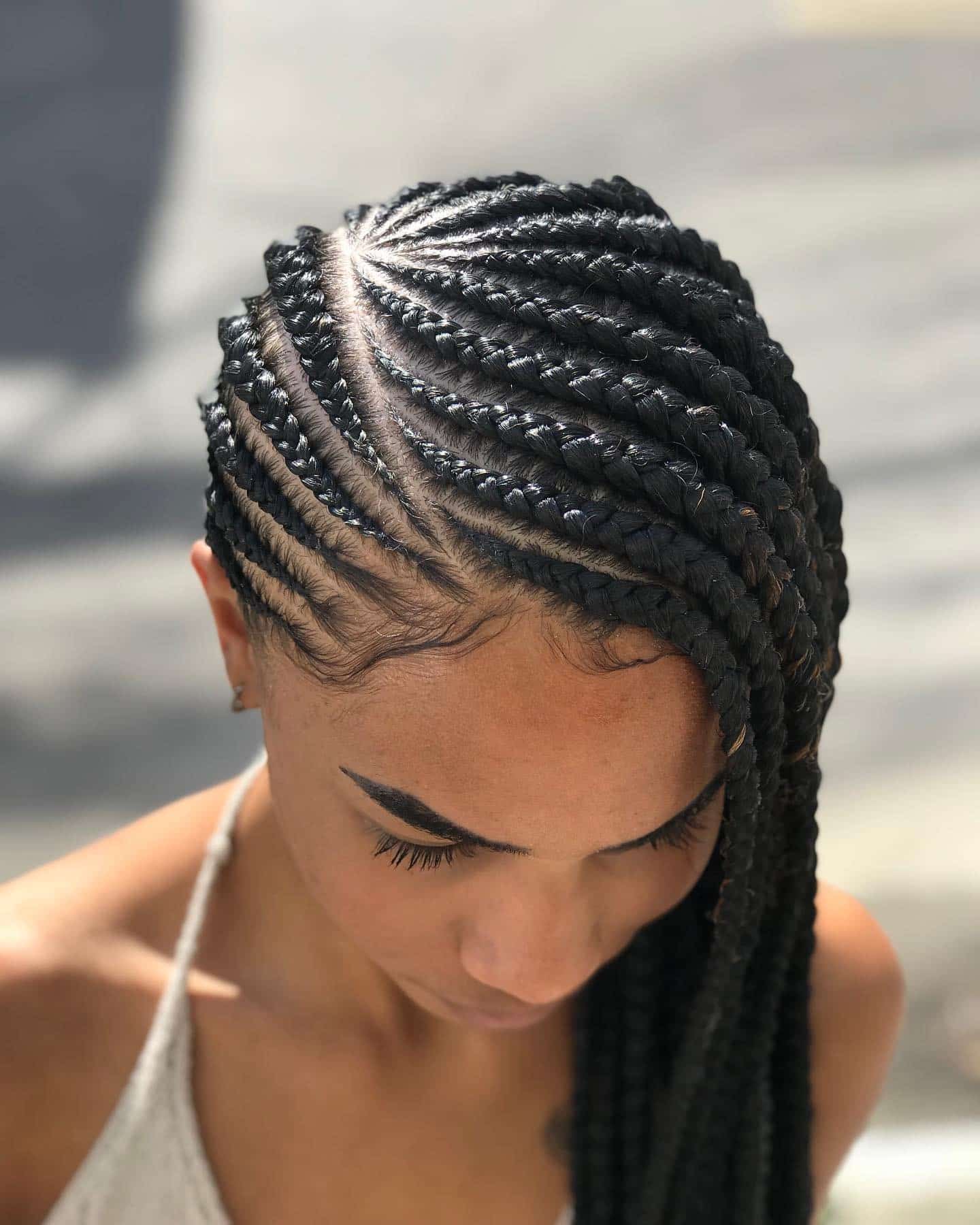 8. Side-Swept Cornrows in Classic Black - Twist Braid Hairstyles