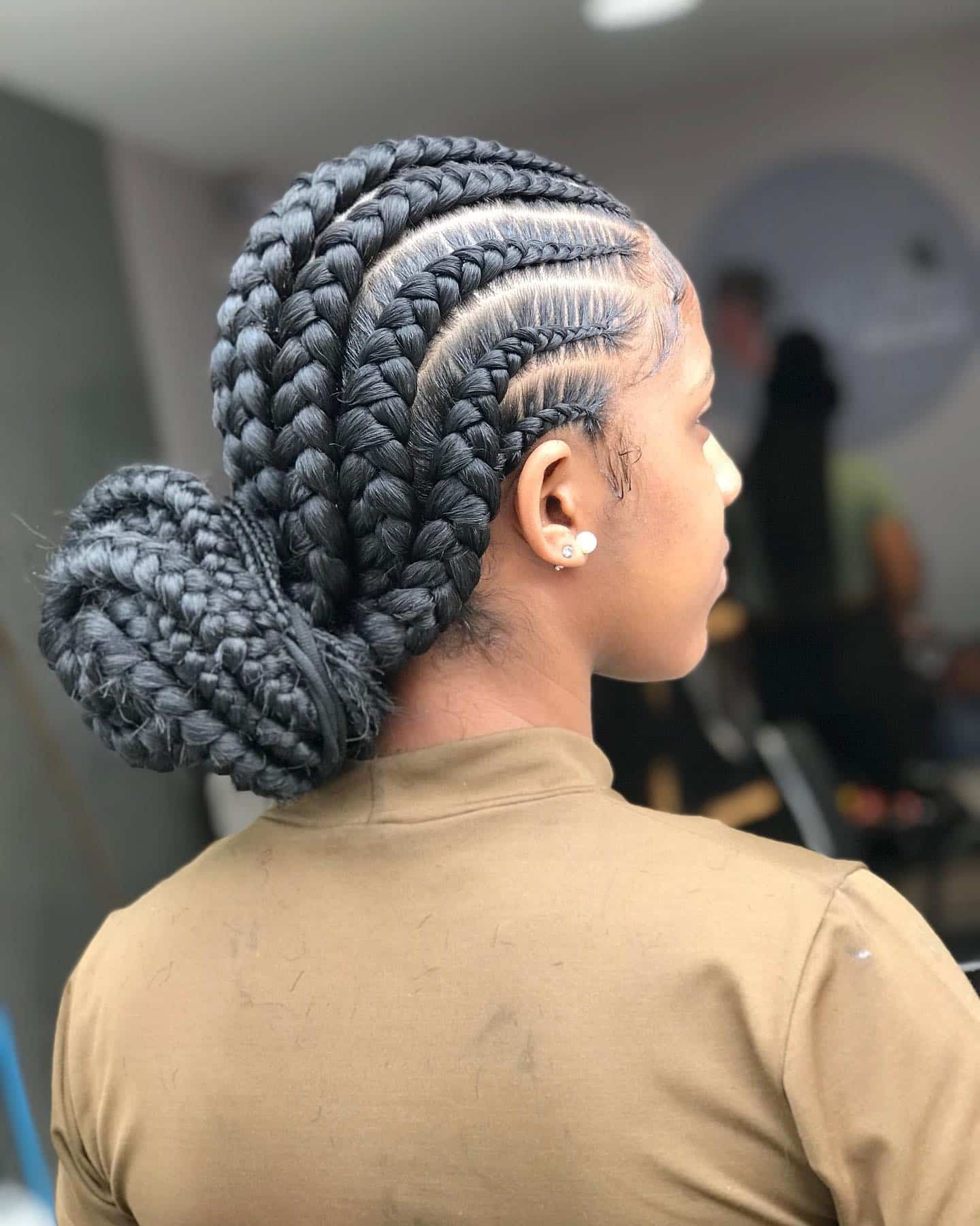 19. Ghana Braids into Low Bun in Charcoal Black - Twist Braid Hairstyles