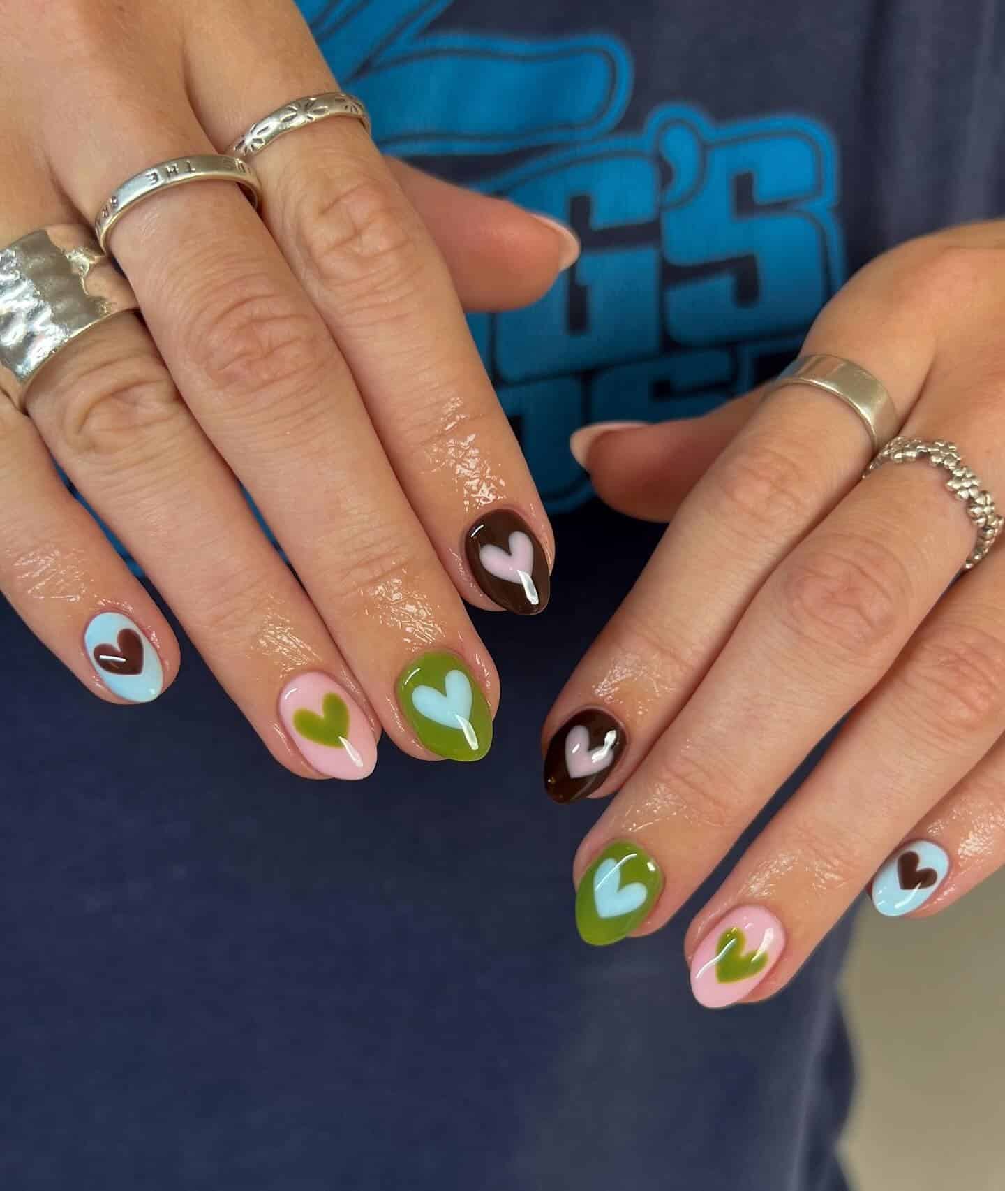 16. Playful Heart Nail Art in Pastel and Dark Tones - june nail ideas