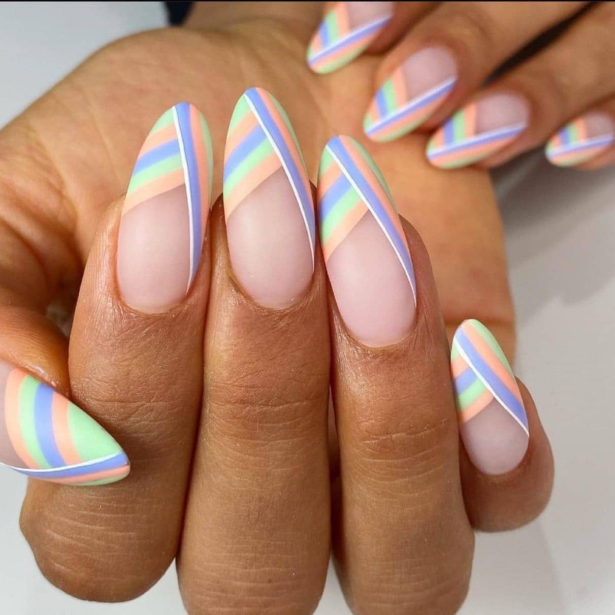 17. Diagonal Pastel Striped Nails - june nail ideas
