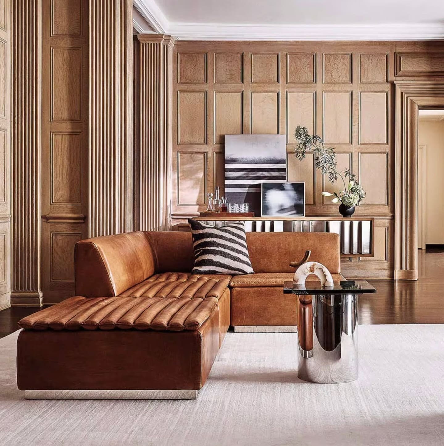 5. Refined Leather with Architectural Walls - light brown sofa living room ideas