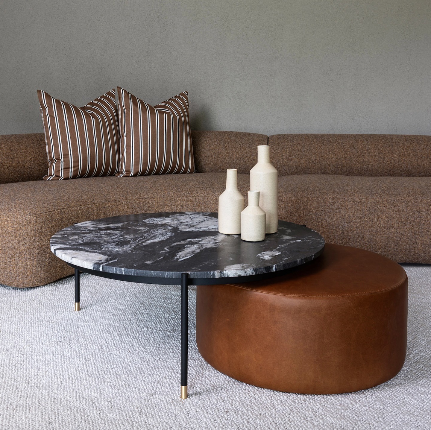 7. Layered Neutrals with Textural Contrast - light brown sofa living room ideas