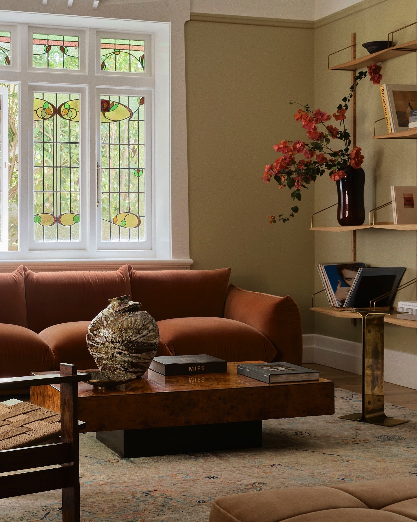 8. Classic Character with Vintage Charm - light brown sofa living room ideas