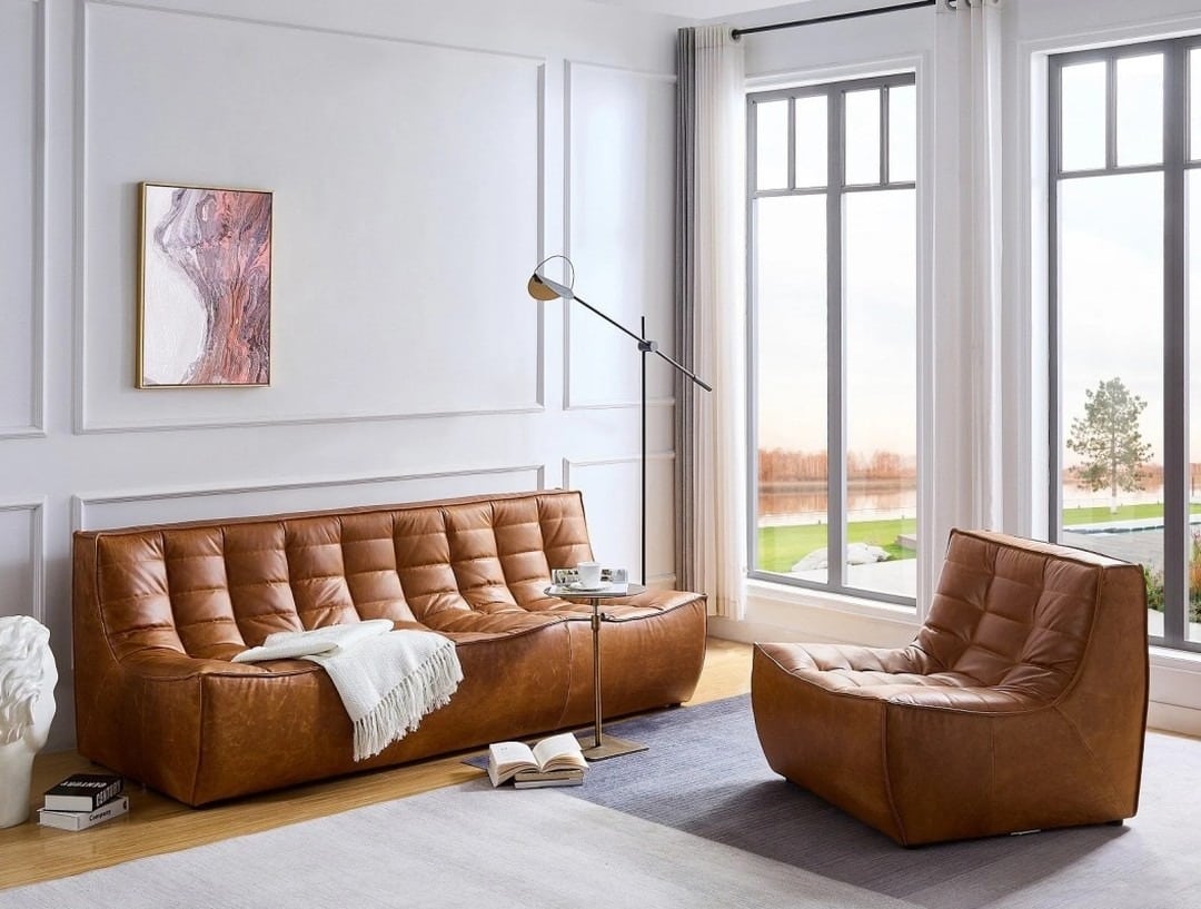 15. Modern Elegance with Quilted Leather - light brown sofa living room ideas