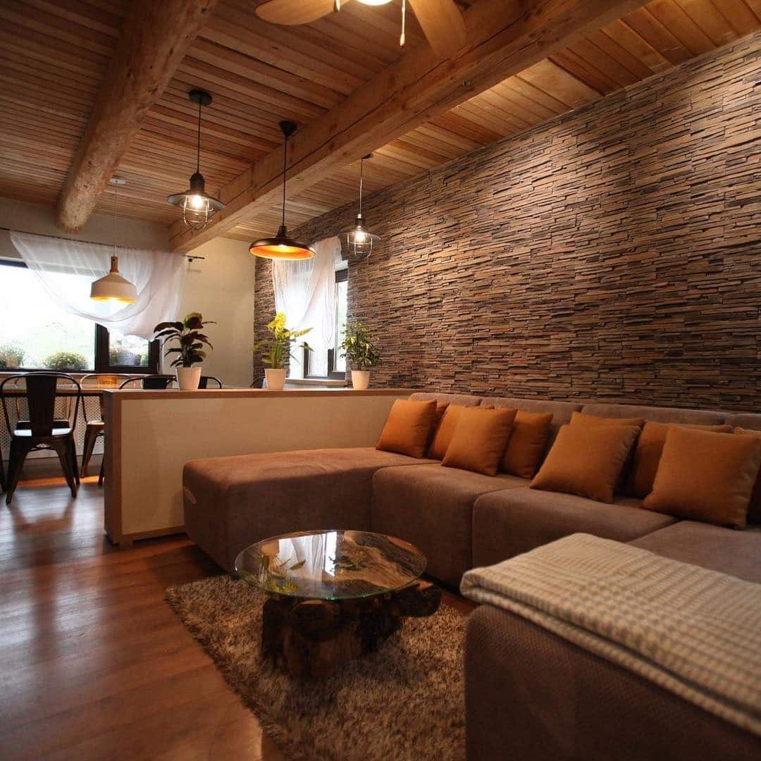 16. Rustic Texture with Earthy Stone Accents - light brown sofa living room ideas