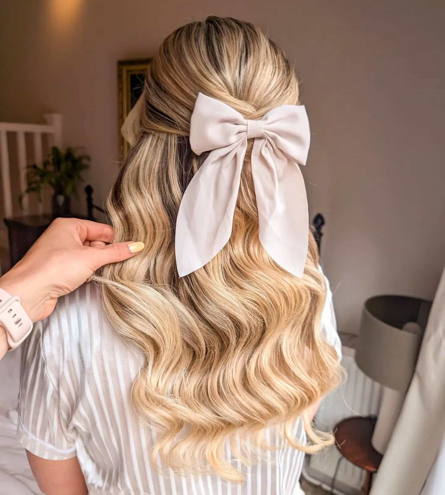 2. Loose Waves with Ivory Bow on Blonde Balayage - Cute Hairstyles