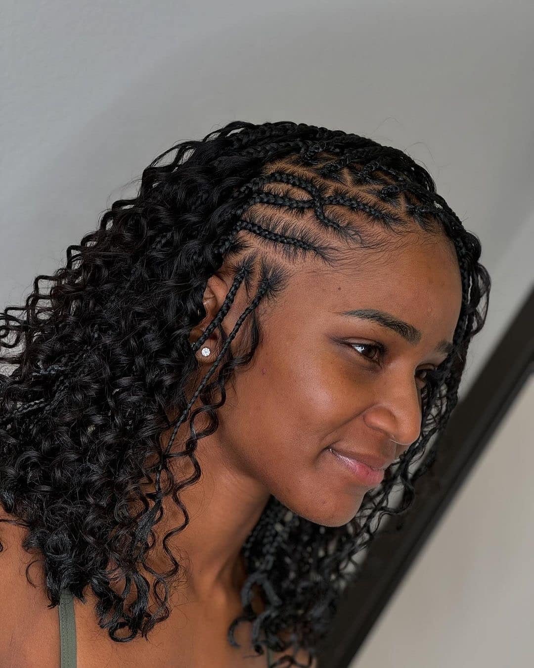 12. Cornrow Braids with Defined Curls on Jet Black Hair - Cute Hairstyles
