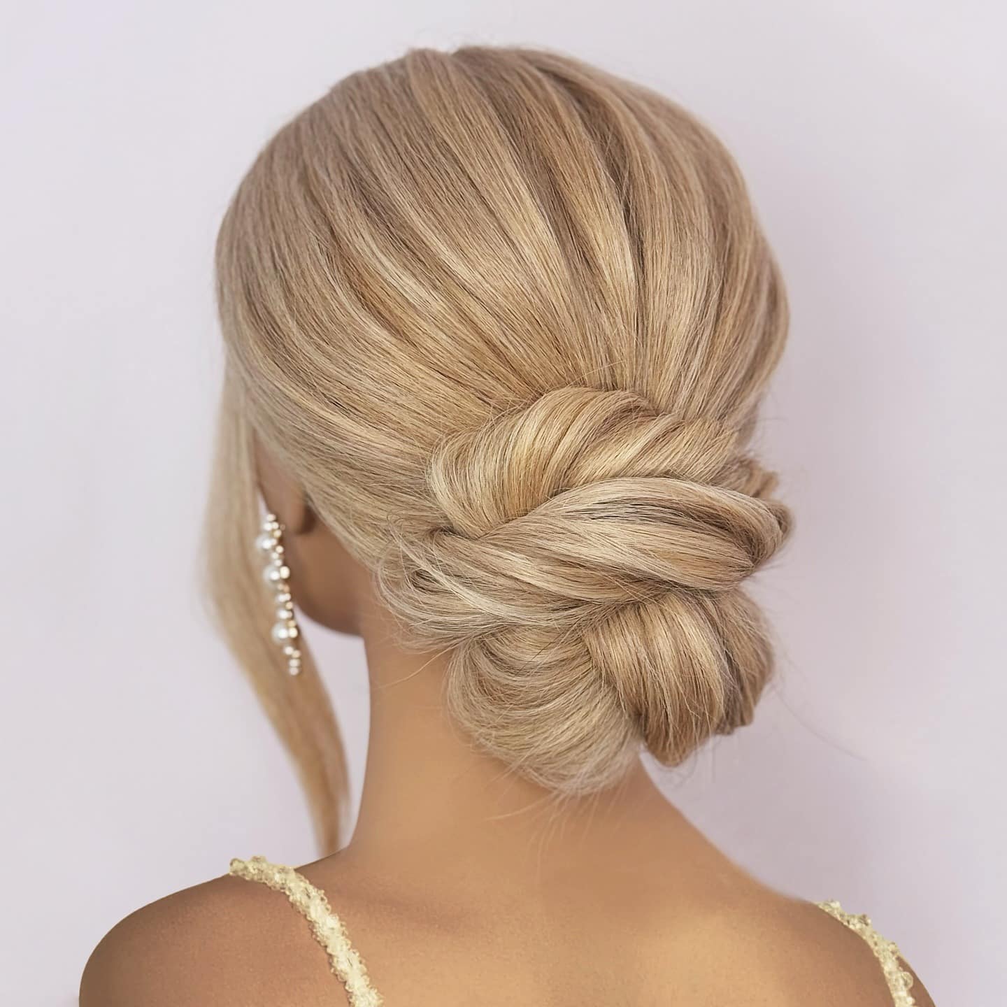 21. Twisted Low Bun on Honey Blonde Hair - Cute Hairstyles