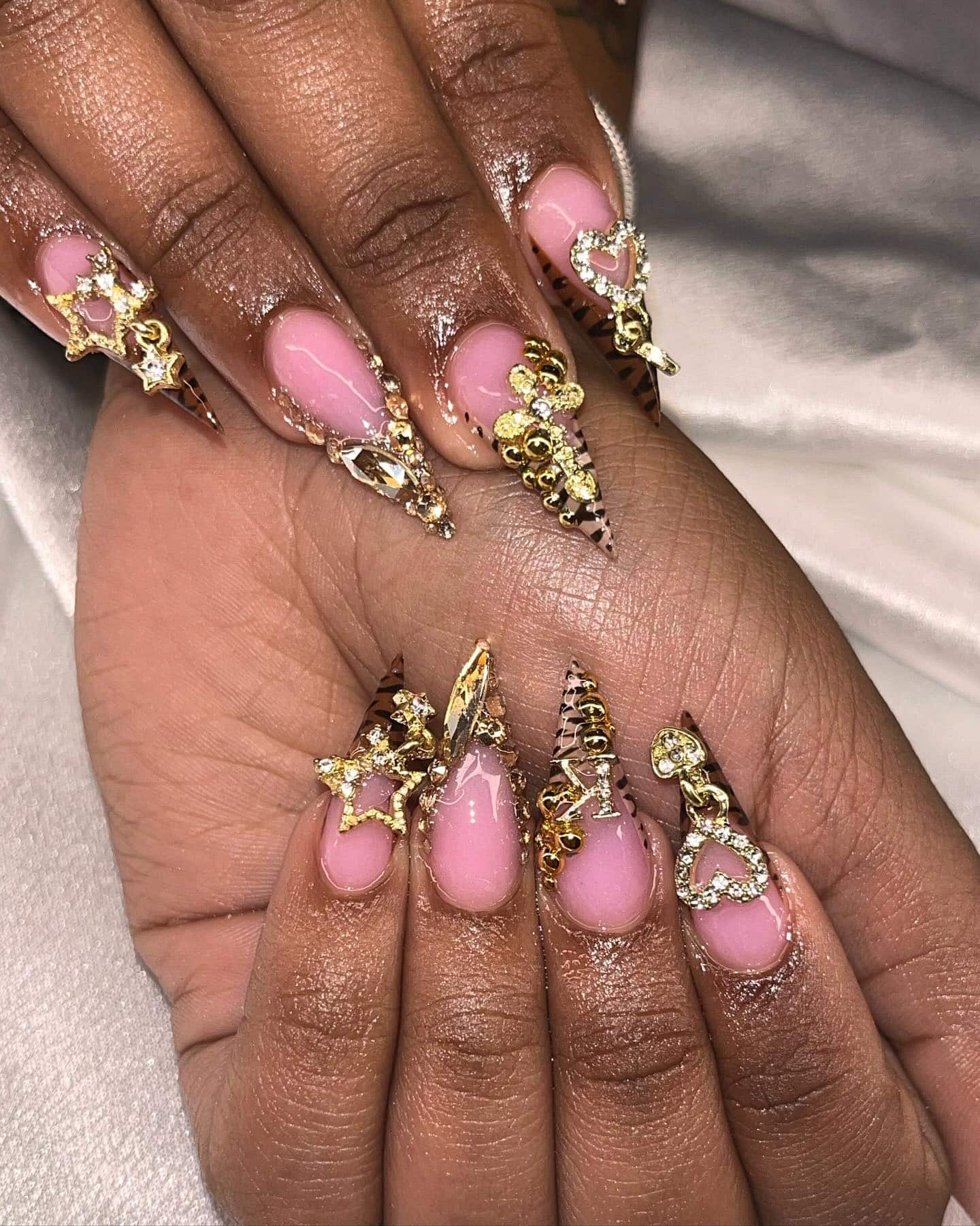 6. Gold Charm Nails with Nude Pink Base - nail ideas for birthday