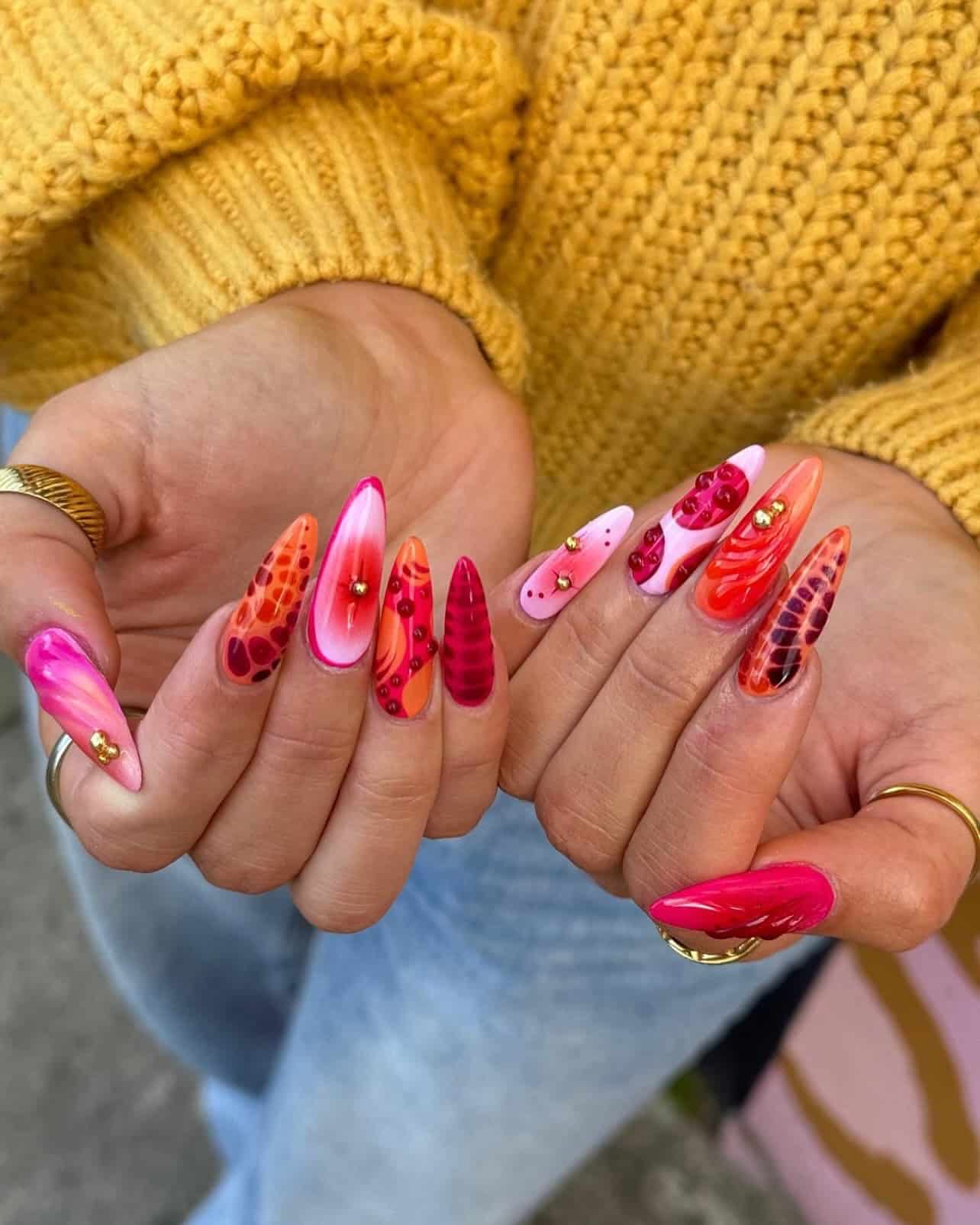 7. Fiery Red and Pink Abstract Nails - nail ideas for birthday