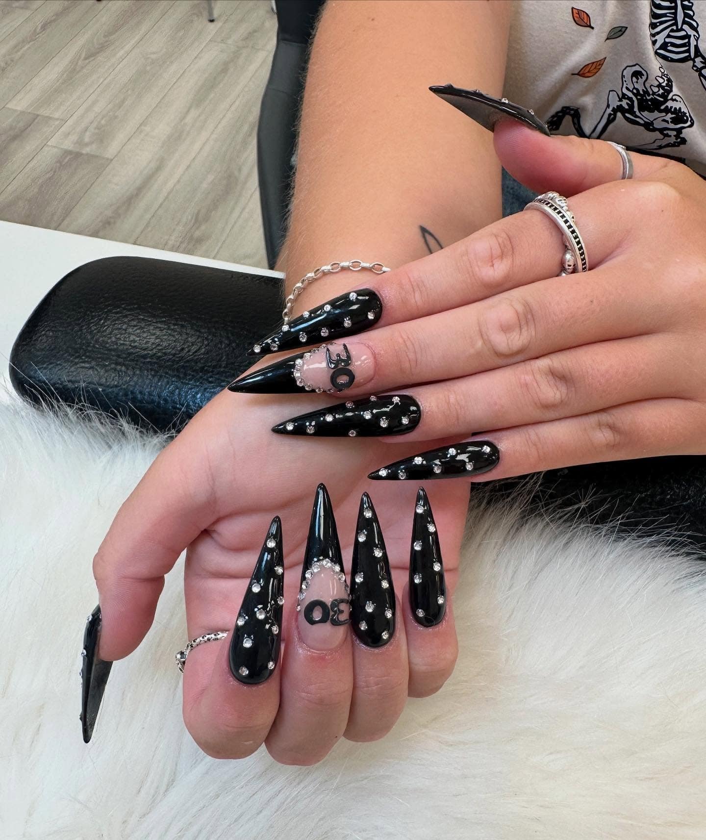 20. Black Stiletto Nails with Crystal Detailing - nail ideas for birthday