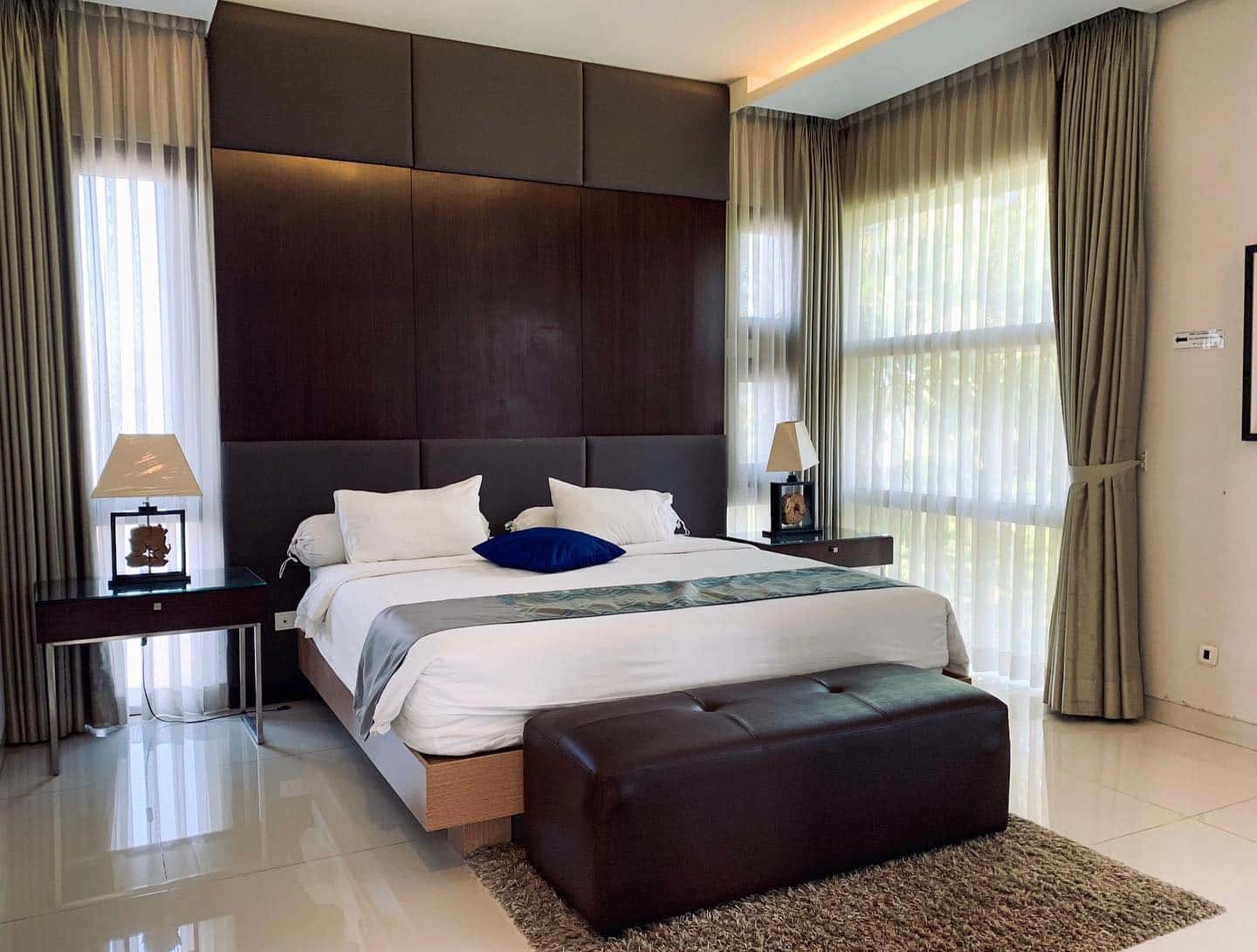 6. Sophisticated Modern with Deep Wood Accents - large bedroom ideas