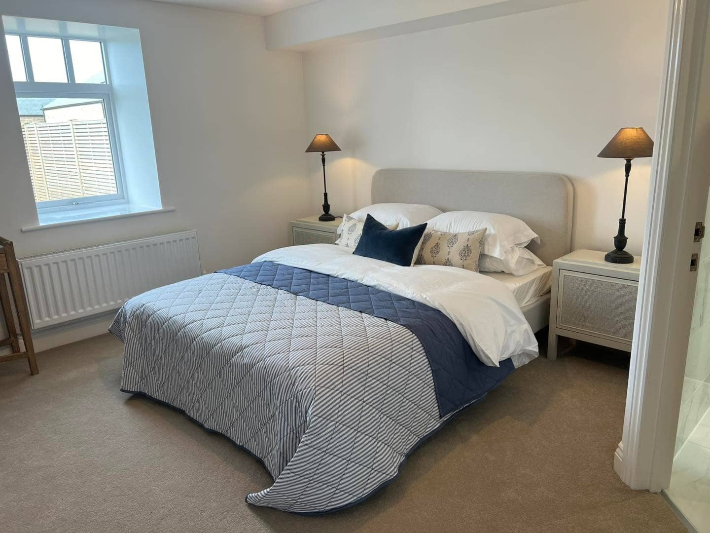 10. Casual Comfort with Navy Highlights - large bedroom ideas