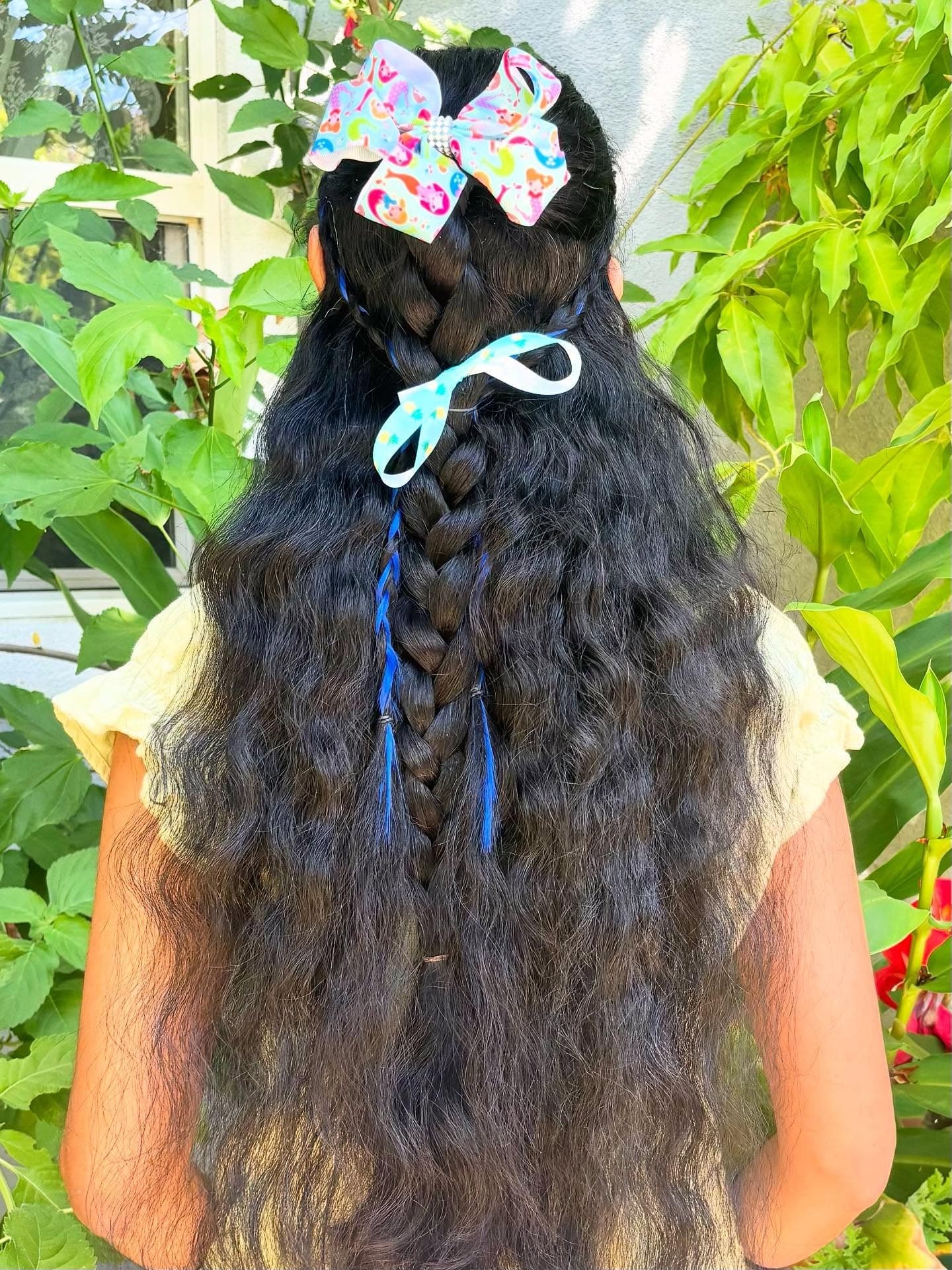1. Braided Cascade with Decorative Bows on Long Black Hair - Hairstyles For School