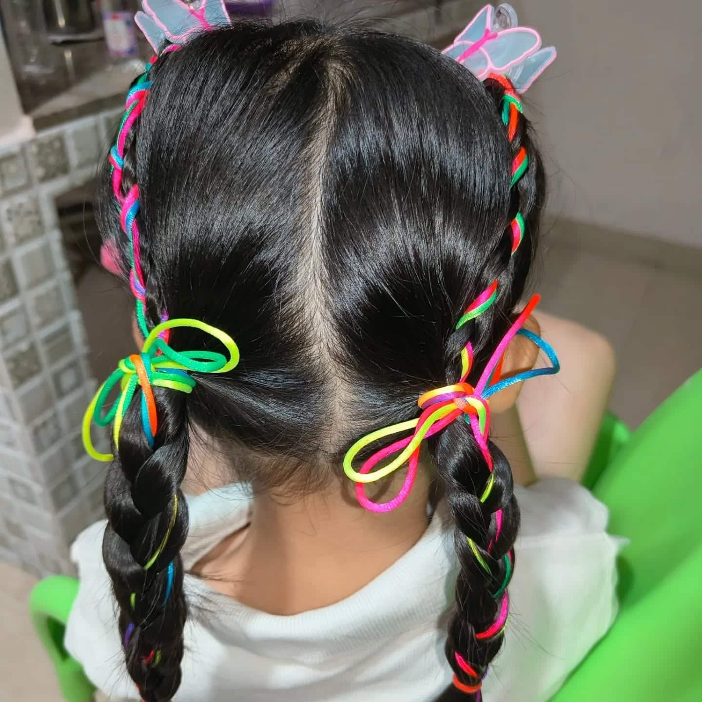 7. Colorful Ribbon-Wrapped Double Braids on Black Hair - Hairstyles For School