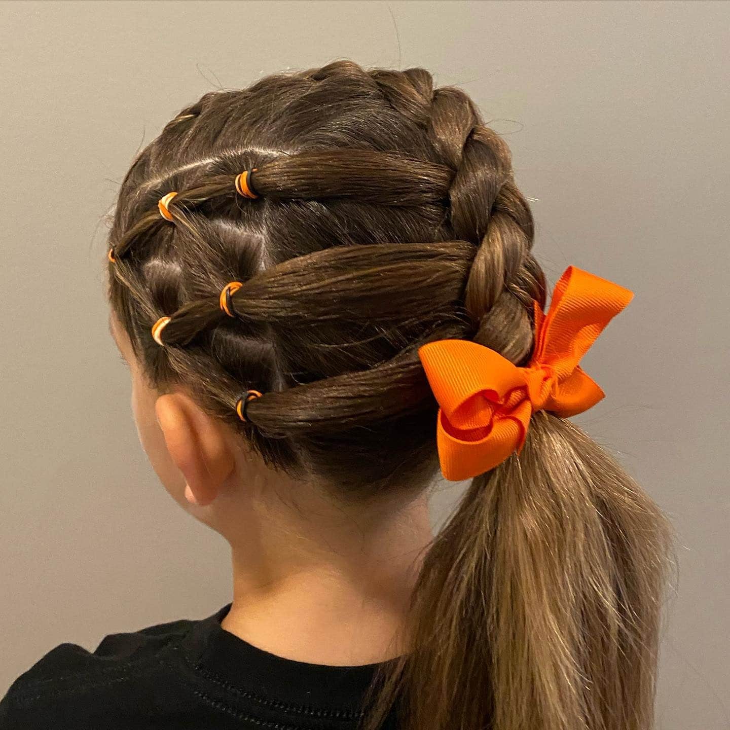 16. Side Braided Ponytail with Orange Ribbon on Chestnut Brown Hair - Hairstyles For School