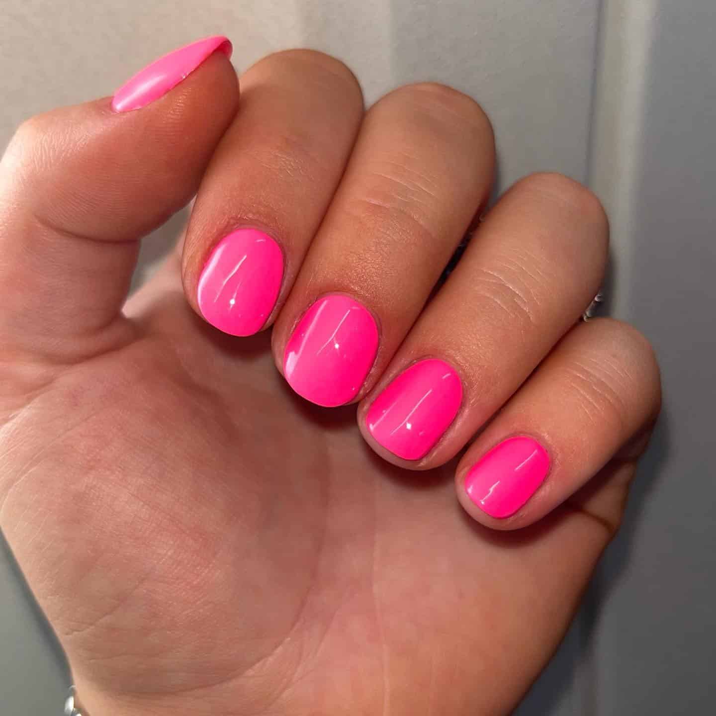 4. Short Round Neon Pink Nails - neon pink nail ideas