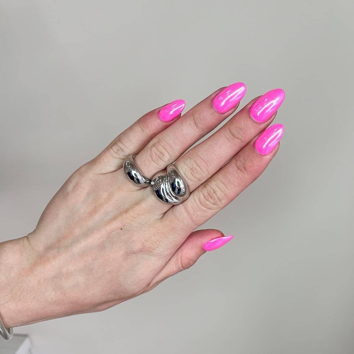 8. High-Gloss Neon Pink Almond Nails - neon pink nail ideas