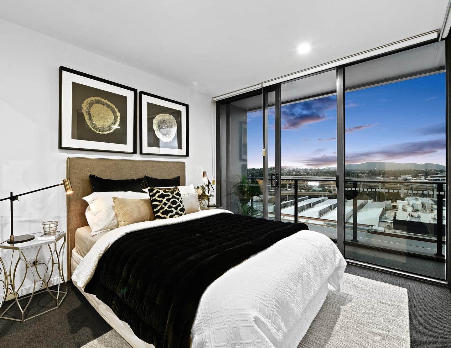 1. Modern Elegance with a Skyline View - black and gold bedroom ideas
