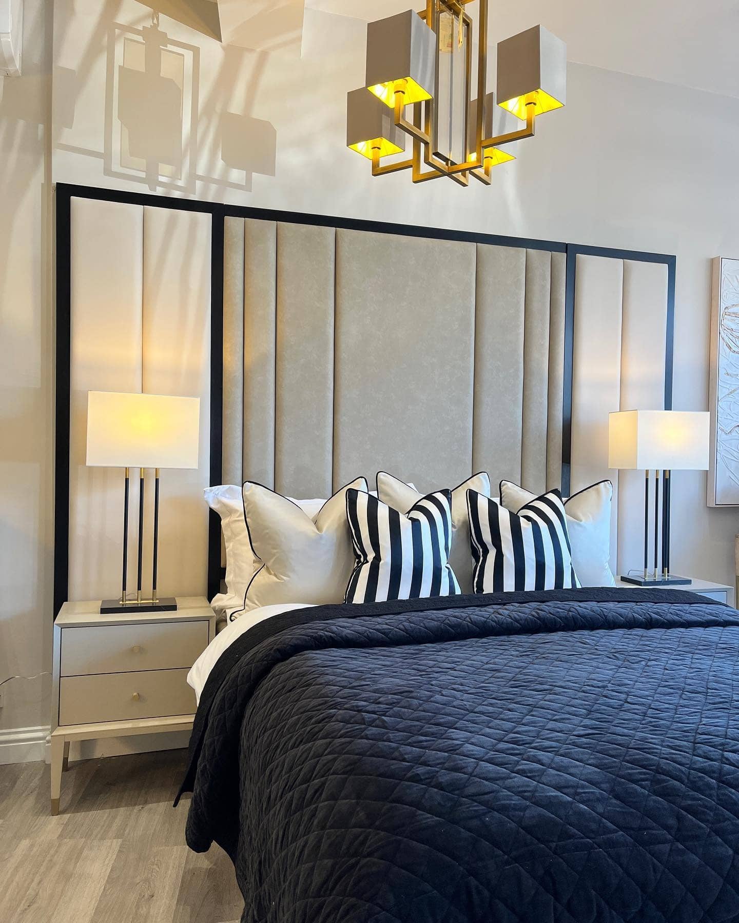 3. Chic Monochrome with Gold Geometry - black and gold bedroom ideas