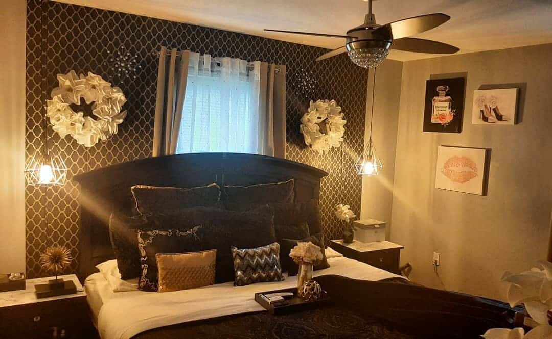 6. Classic Drama with Patterned Backdrop - black and gold bedroom ideas