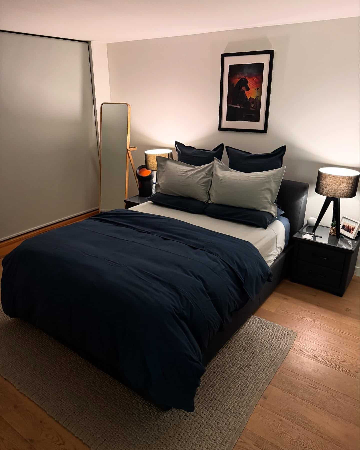 3. Minimalist Elegance with Bold Contrast - navy blue and grey bedroom ideas