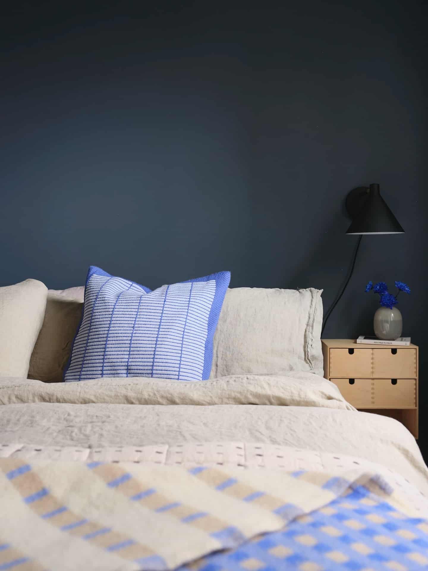 17. Modern Simplicity with Navy Backdrop - navy blue and grey bedroom ideas