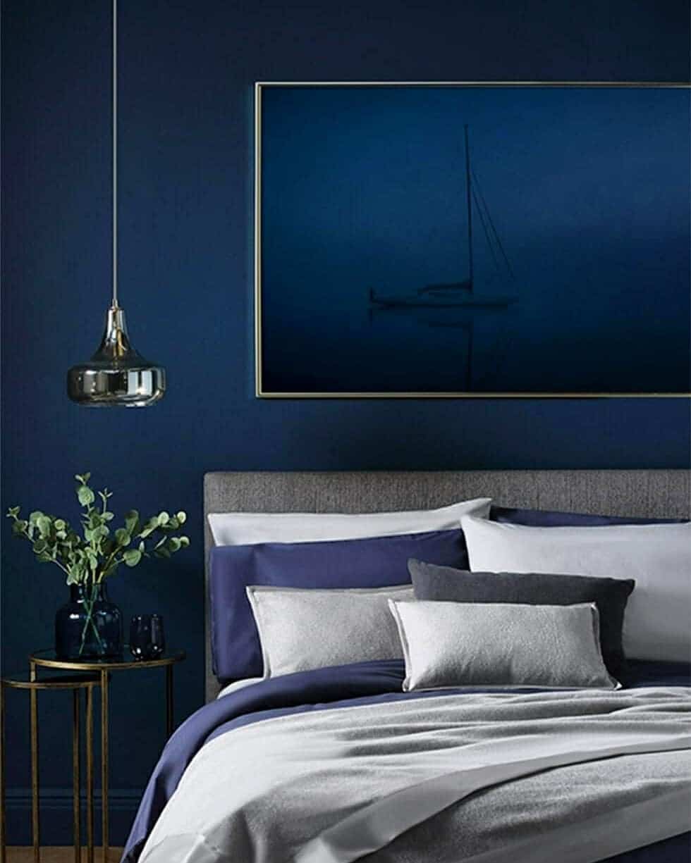 18. Deep Contrast with Metallic Accents - navy blue and grey bedroom ideas