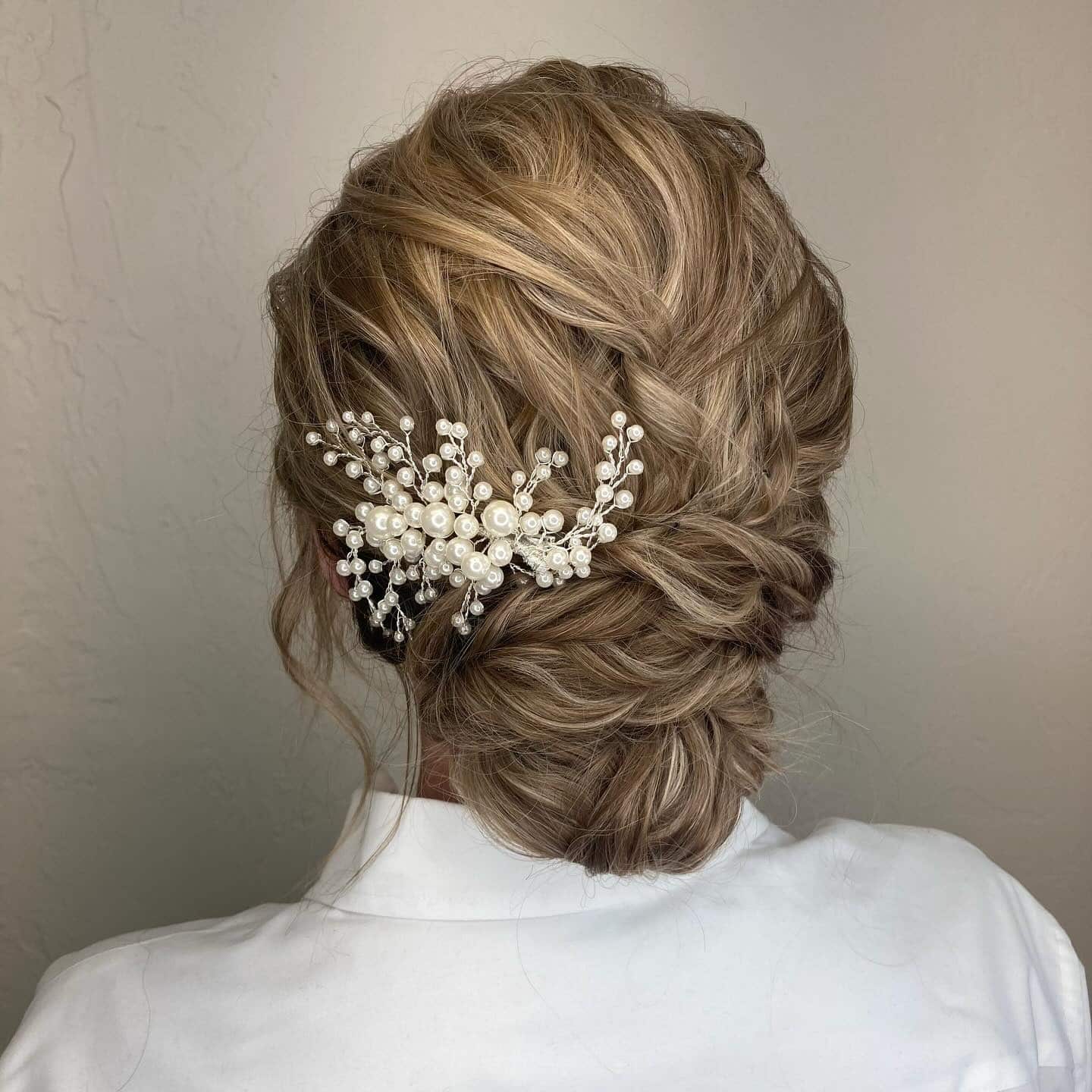1. Romantic Blonde Textured Updo with Pearl Accent - Wedding Hairstyles