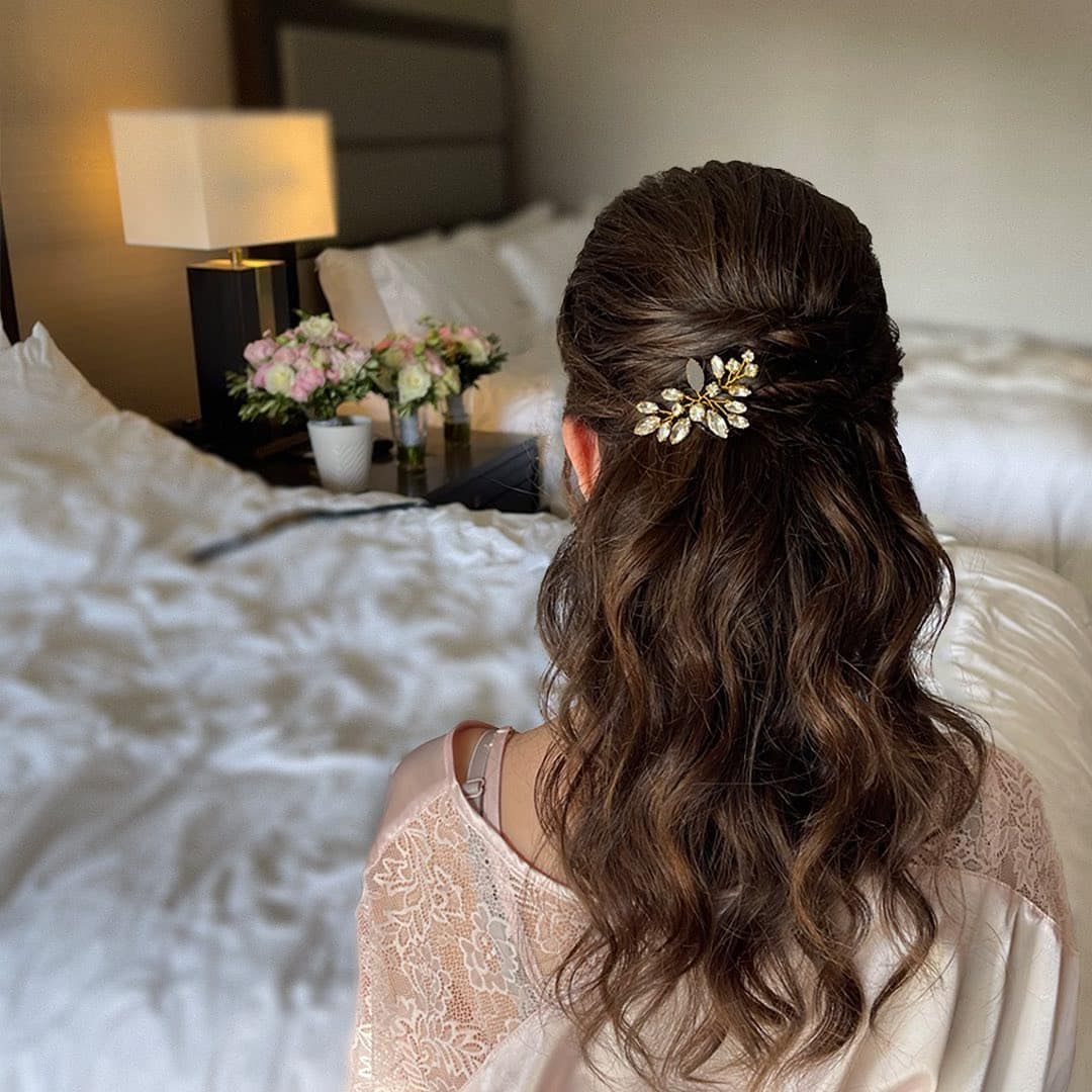 2. Classic Brunette Half-Up Waves with Golden Clip - Wedding Hairstyles