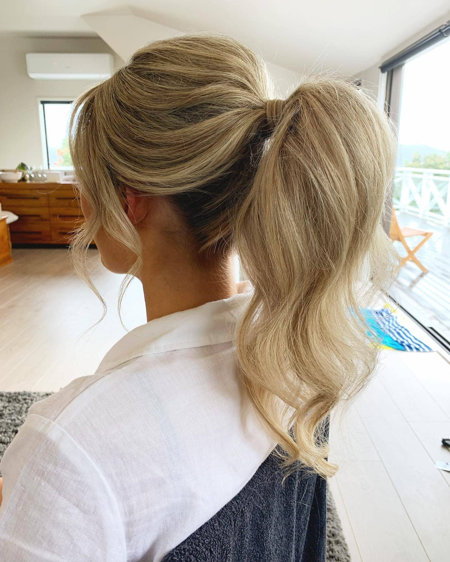 12. Soft Blonde Ponytail with Volume and Face-Framing Layers - Wedding Hairstyles