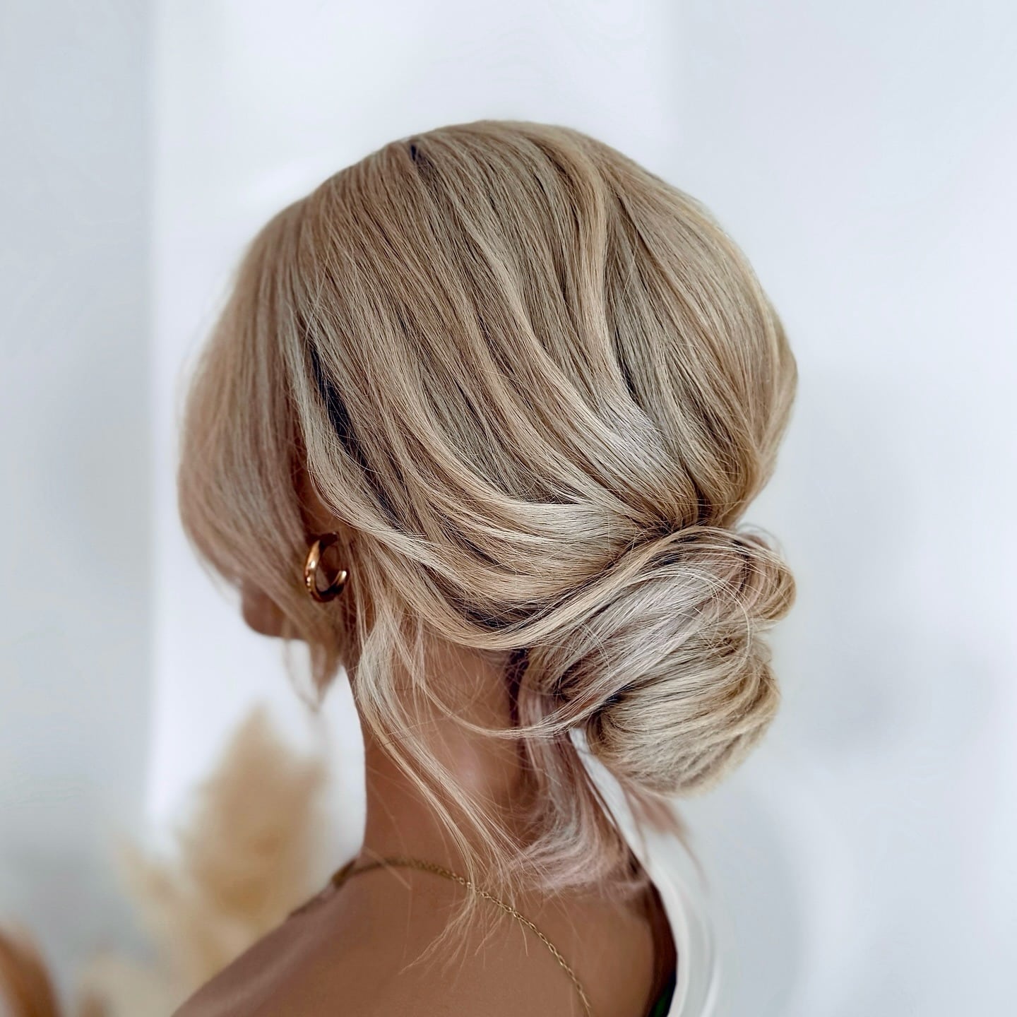 19. Low Blonde Chignon with Soft Texture - Wedding Hairstyles