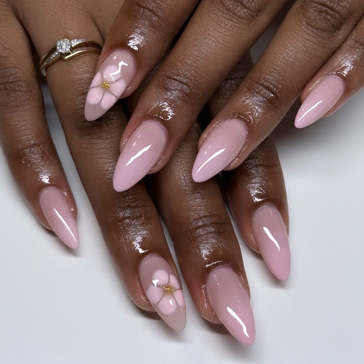 8. Pastel Pink Almond Nails with 3D Floral Accent - pink almond nail ideas