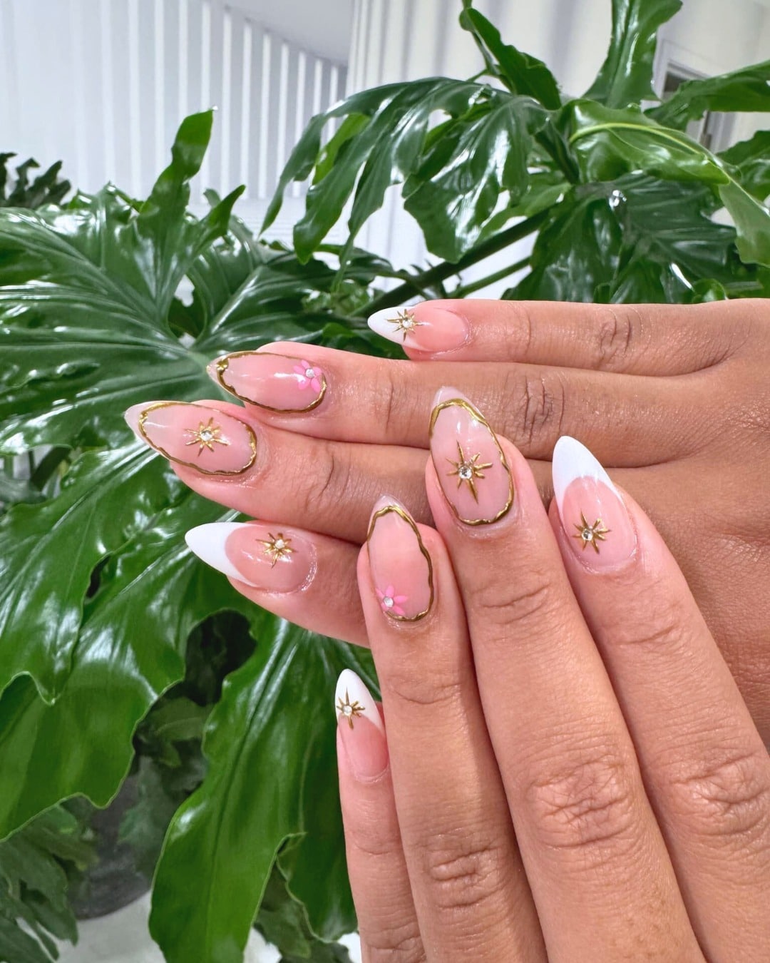 12. Pink Almond Nails with Golden Frame and Star Accents - pink almond nail ideas