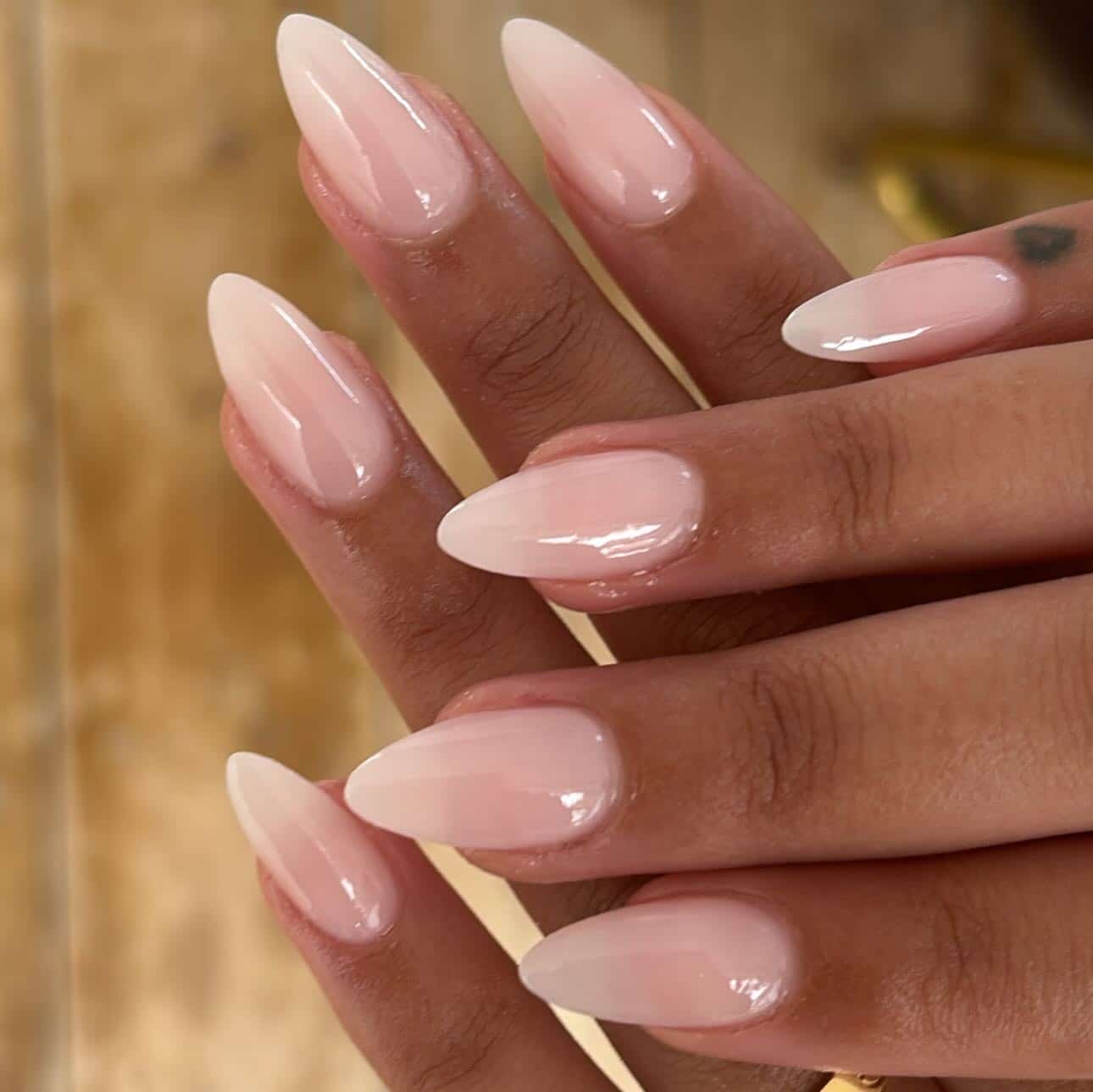 15. Subtle Pink Almond Ombre - pink almond nail ideas