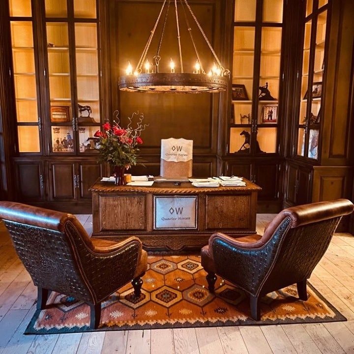 8. Rustic Elegance with Leather and Warm Lighting - rustic home office ideas