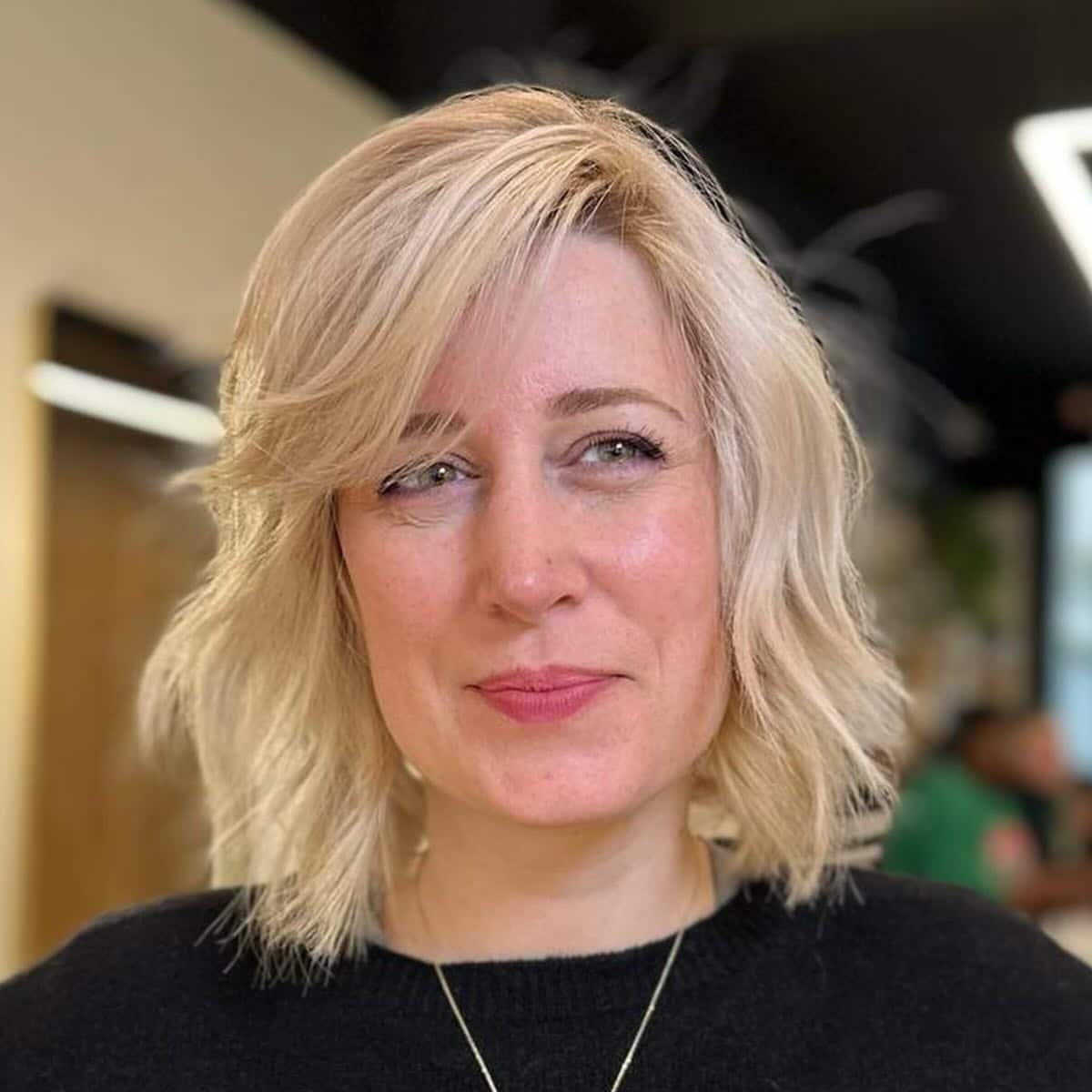 2. Soft Blonde Waves with Side Fringe - Short Wavy Hairstyles