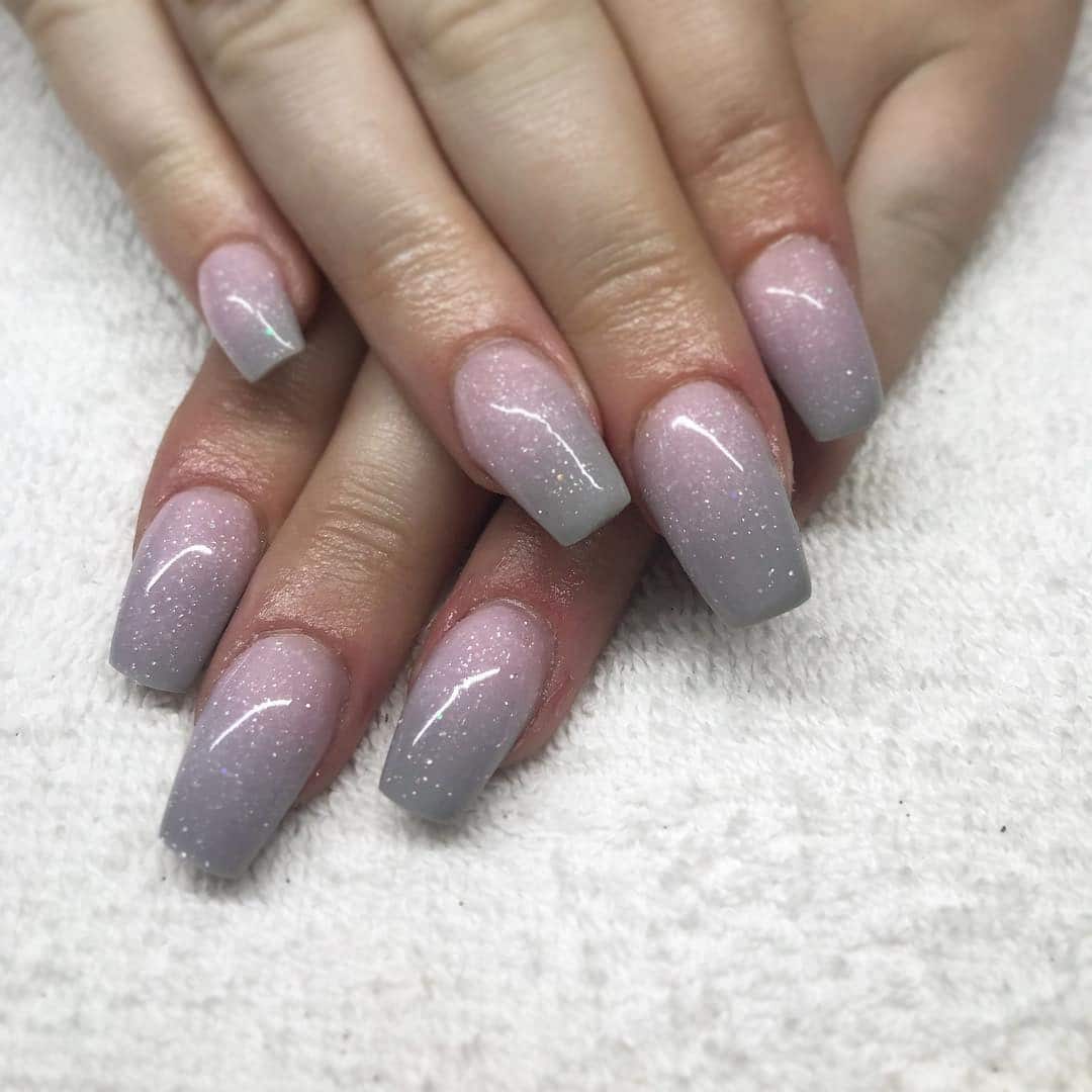3. Subtle Ombre Shimmer in Pink and Grey - pink and grey nail ideas