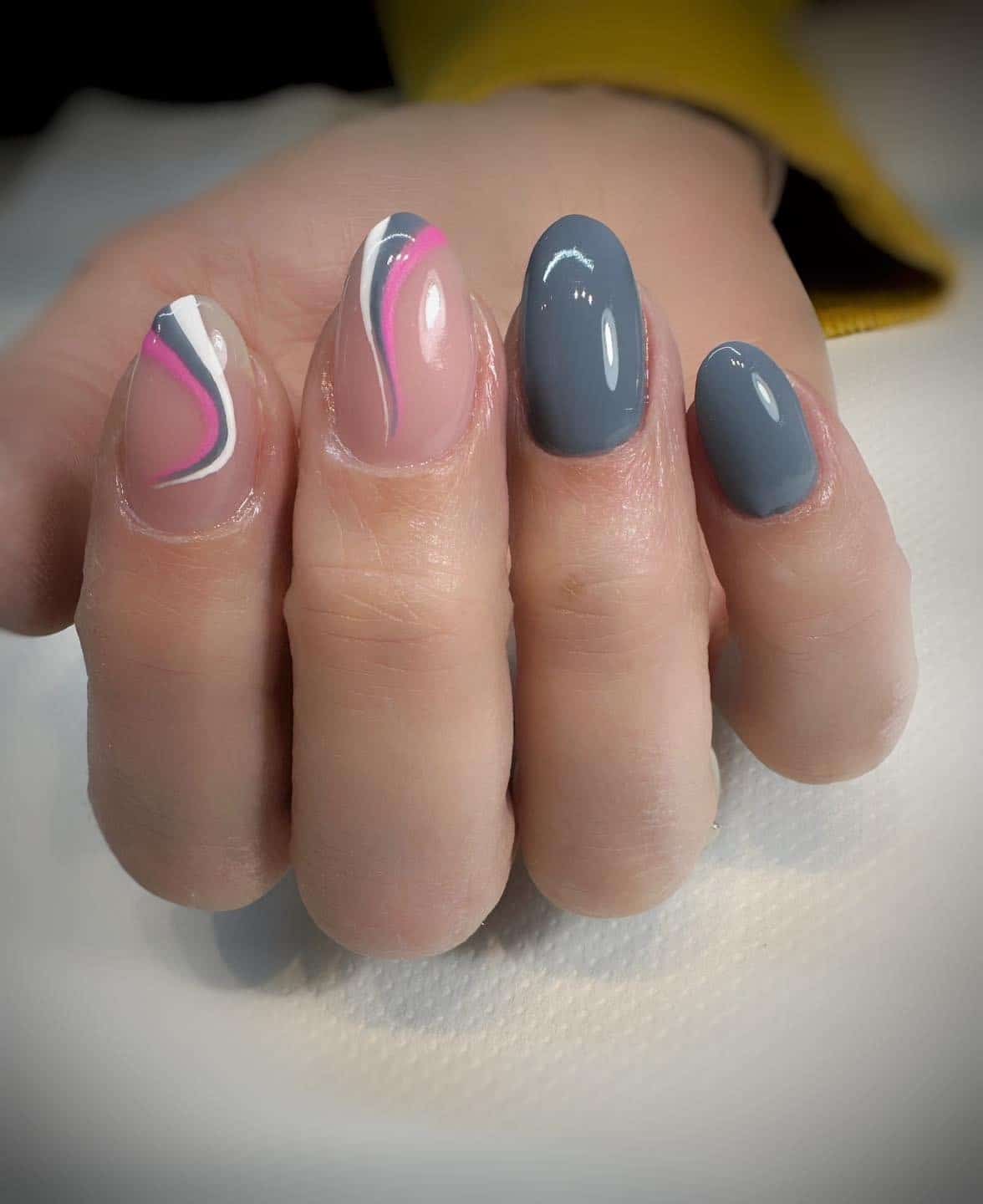 7. Modern Grey with Pink Wave Accents - pink and grey nail ideas