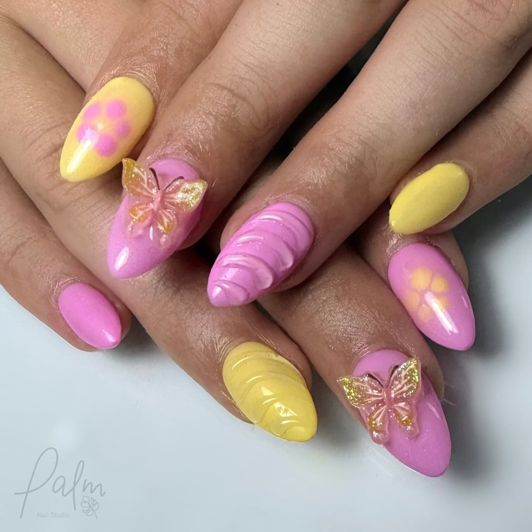 2. Butterfly Charm Accents - pink and yellow nail ideas