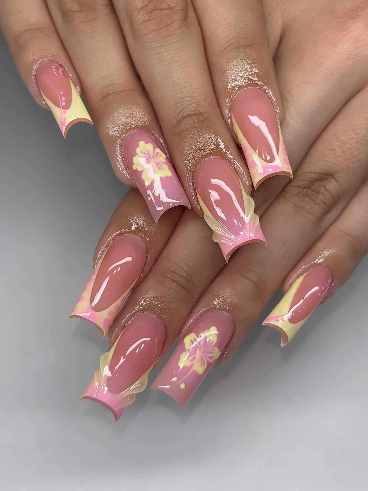 5. Tropical Blossom Tips - pink and yellow nail ideas