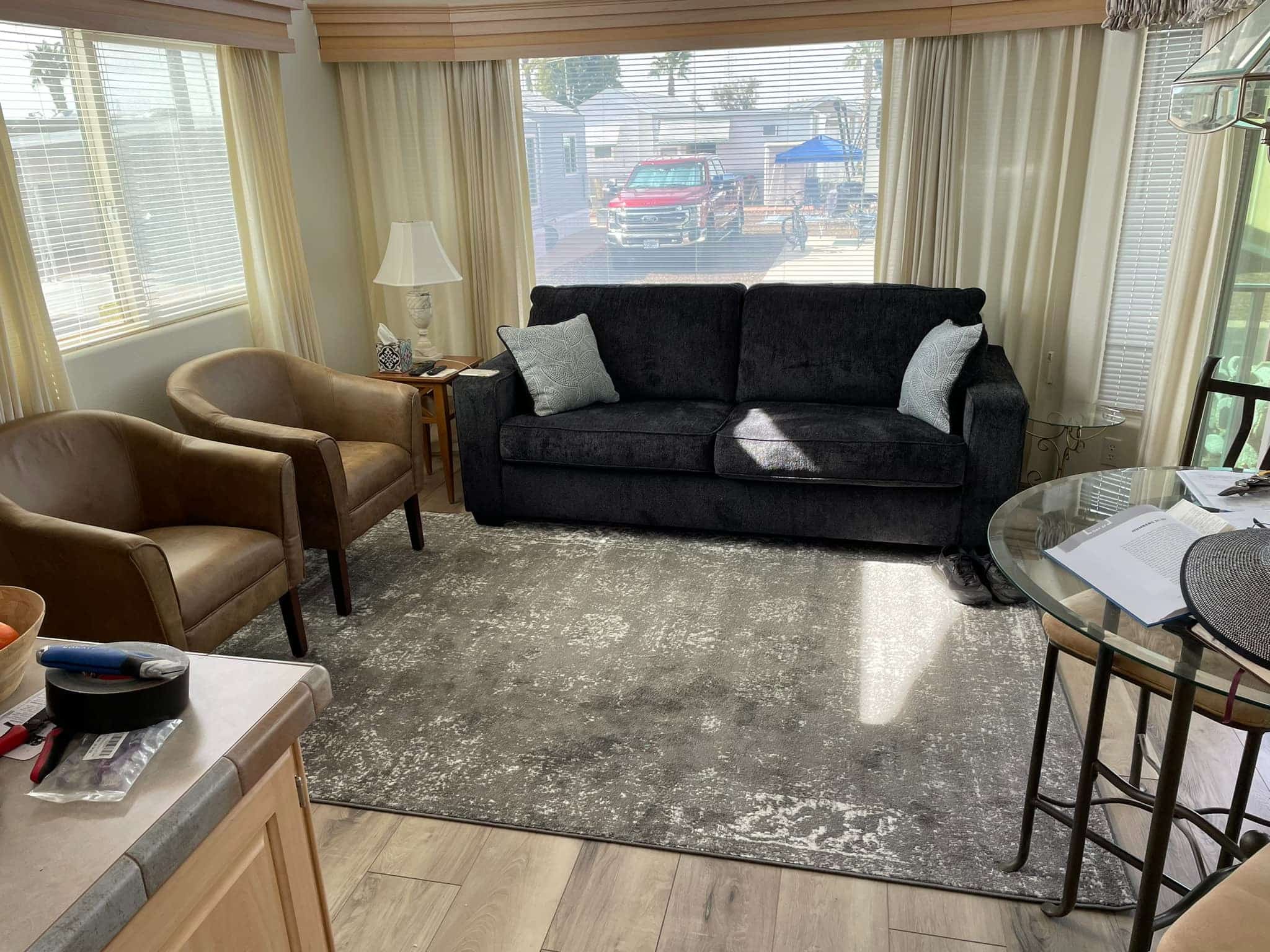 16. Compact Comfort with Natural Light - mobile home living room ideas