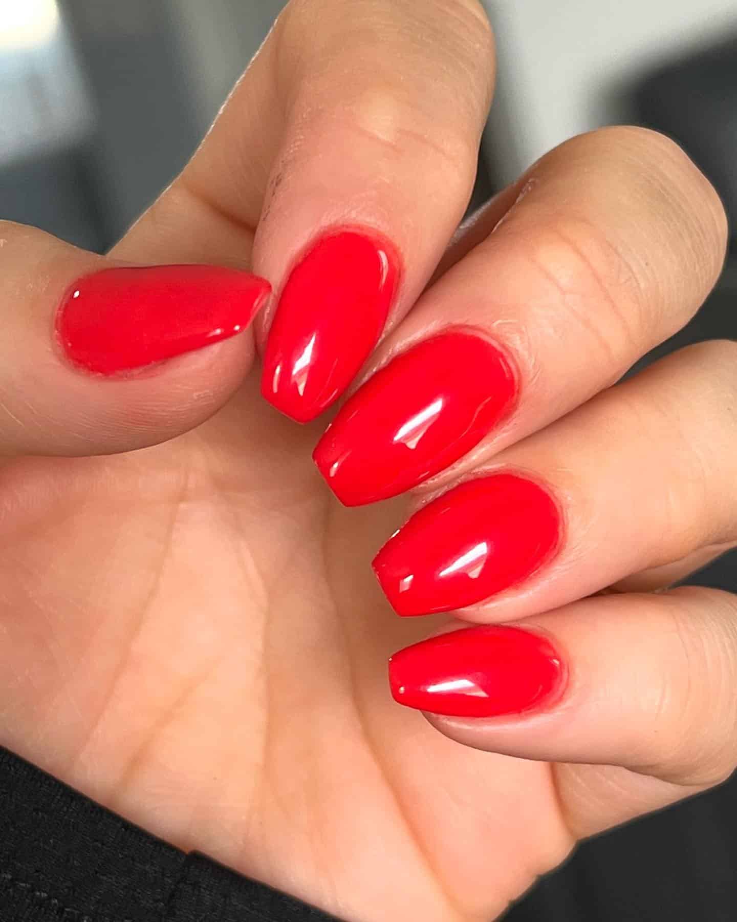 2. Glossy Crimson Almond Coffin - red coffin nail ideas