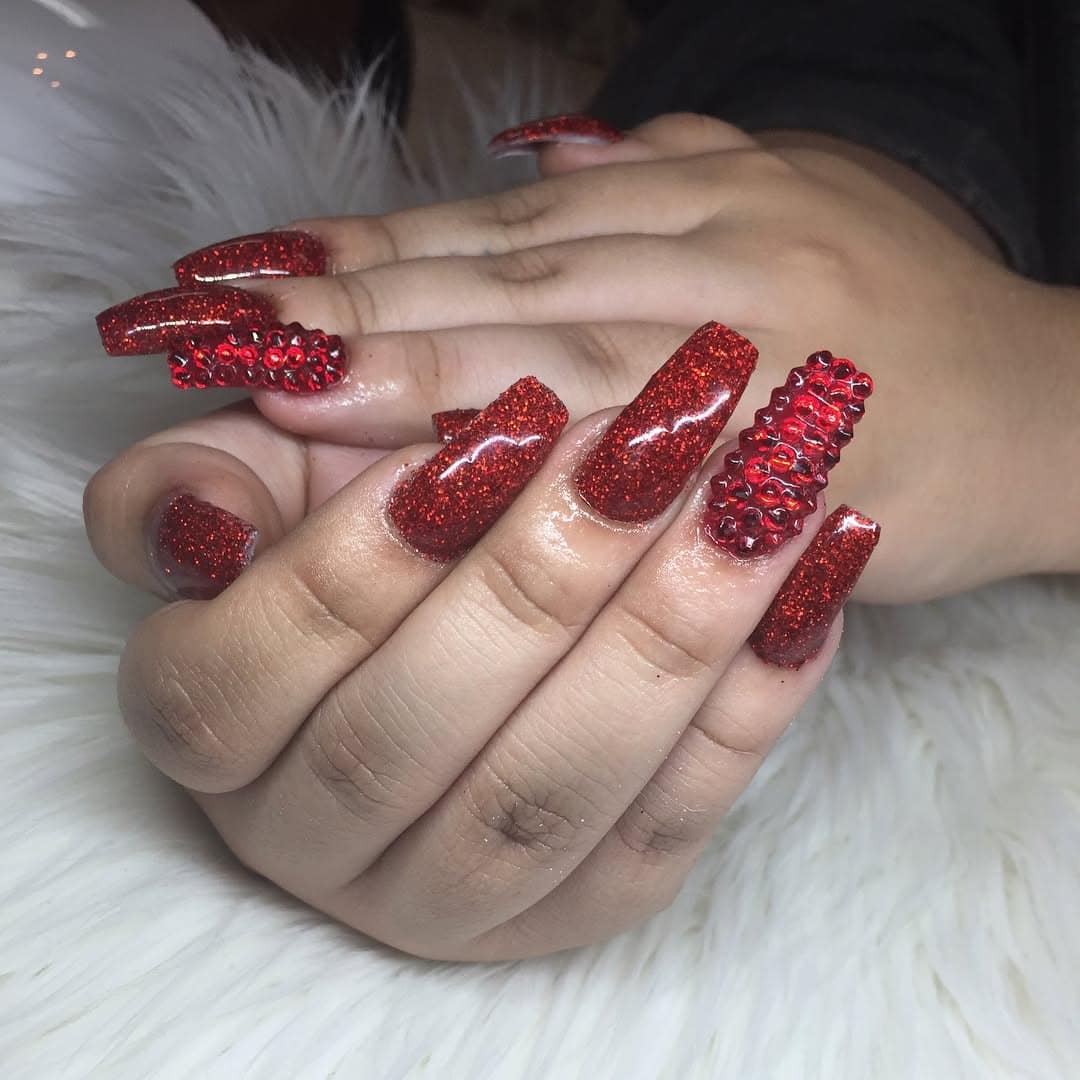 6. Glittered Ruby Coffin with Embellishments - red coffin nail ideas