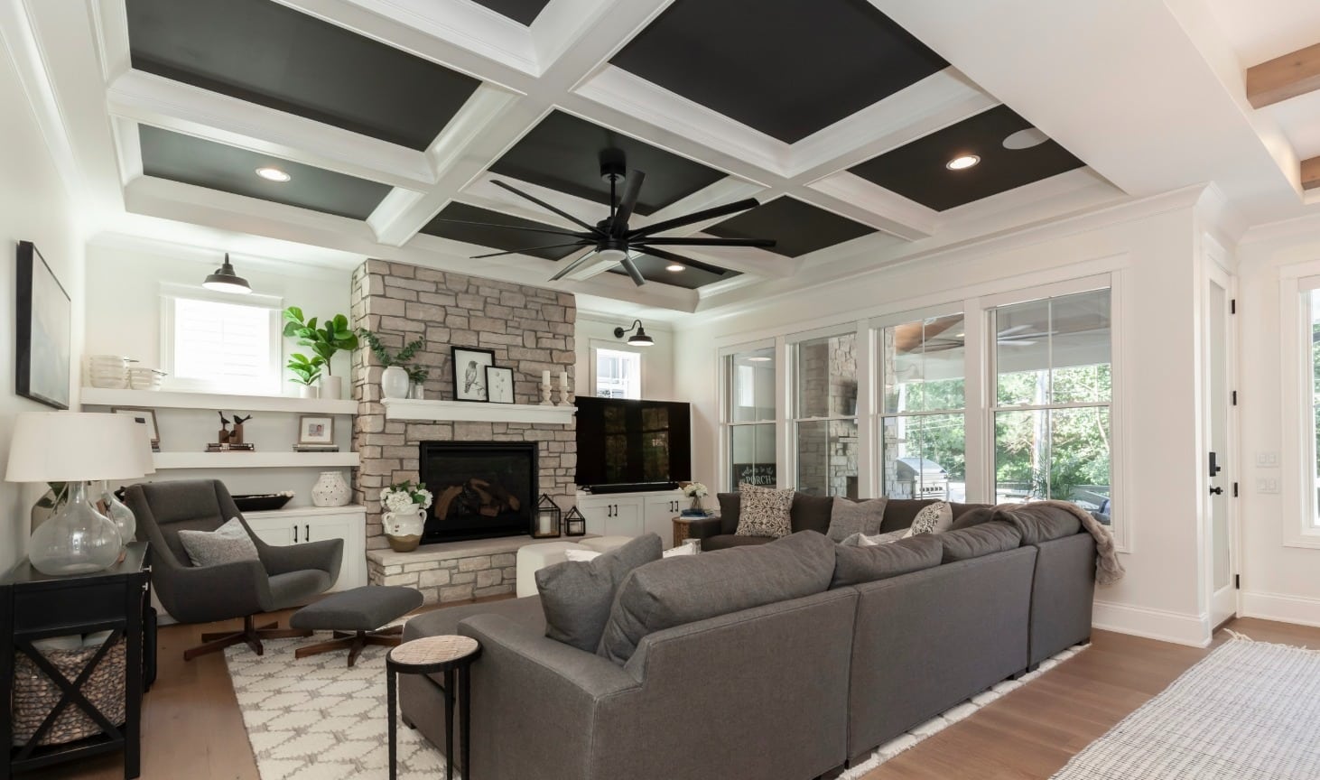 2. Layered Comfort with Classic Stone - stone fireplace living room ideas